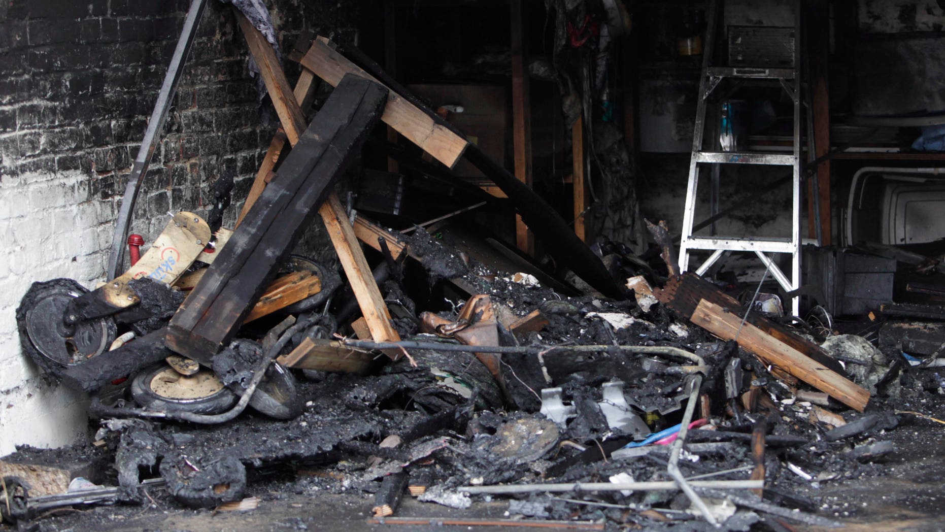Jan. 10: Burnt debris fills garage in Southeast Washington, where a Washington lobbyist was found dead. Lobbyist Ashley Turton, the wife of a White House adviser Dan Turton, was found dead inside a burning car in the garage.