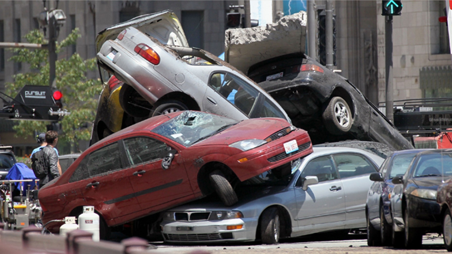 Workers stage a car accident during the filming of the movie "Transformers 3" in Chicago, Illinois.
