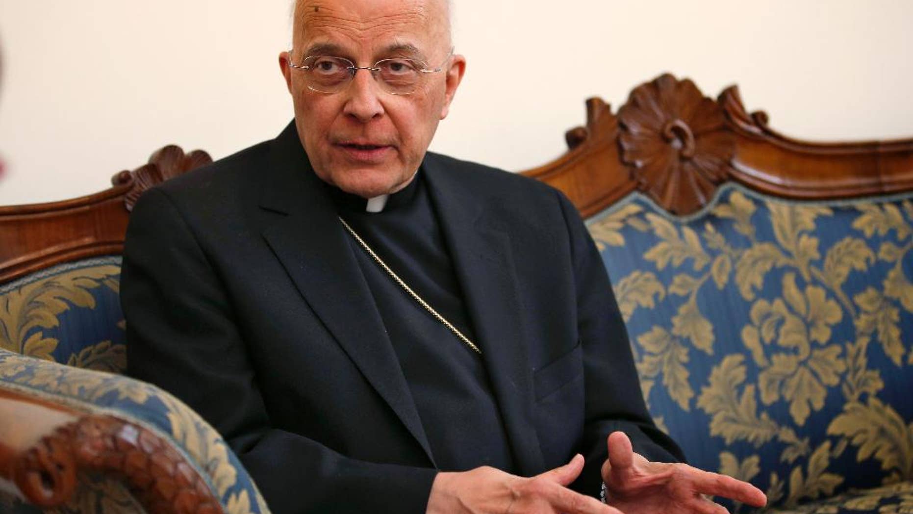 FILE - In this March 14, 2013 file photo, Cardinal Francis George speaks during an interview at the North American College in Rome. On Friday, March 7, 2014, the Archdiocese of Chicago announced that George is starting another round of chemotherapy to address signs of cancer returning to the area around his right kidney. He was diagnosed with cancer in August 2012 and had chemotherapy then. The diocese says the cancer was dormant for more than a year. (AP Photo/Michael Sohn, File)