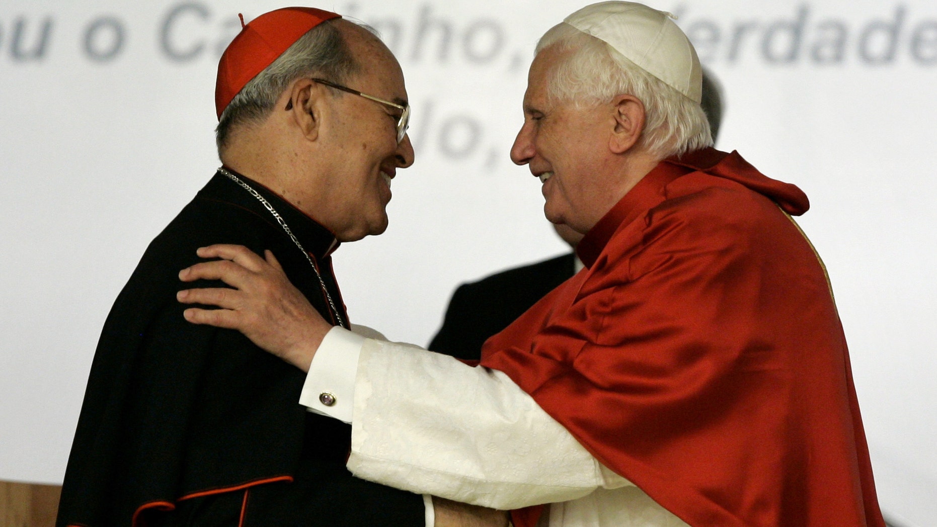 In this 2007 fphoto, Pope Benedict XVI, right, embraces Cardinal Jaime Ortega Alamino, Archbishop of Havana, Cuba, during the inauguration ceremony of the V Conference of Latin American and the Caribbean Bishops in Aparecida, Brazil.