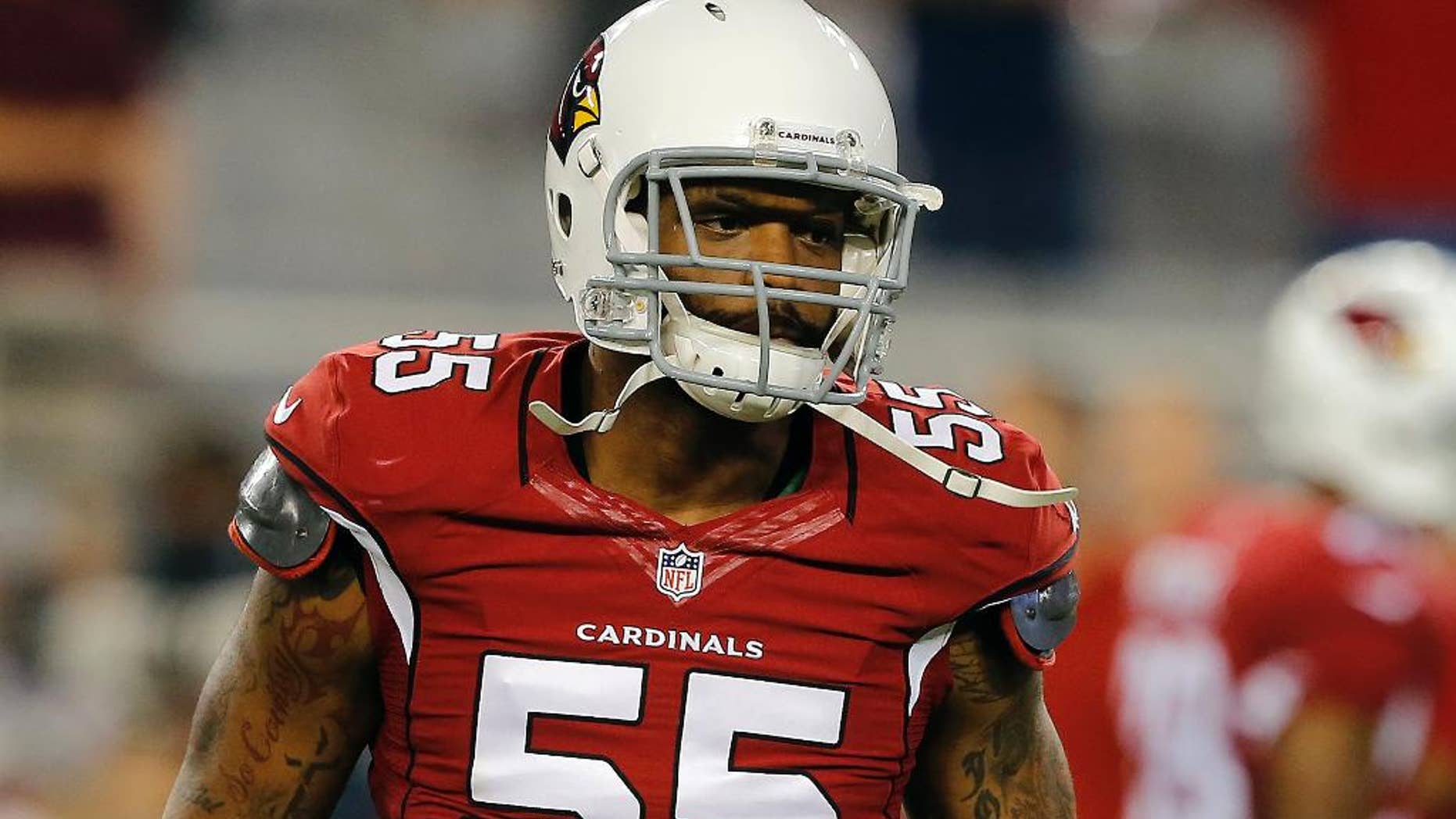 FILE- In this Monday, Sept. 8, 2014, file photo, Arizona Cardinals outside linebacker John Abraham (55) looks on during the second half of an NFL football game against the San Diego Chargers, in Glendale, Ariz. Arizona coach Bruce Arians said Monday, Sept. 15, 2014, outside linebacker John Abraham will return to the Cardinals on Tuesday. (AP Photo/Rick Scuteri, File)