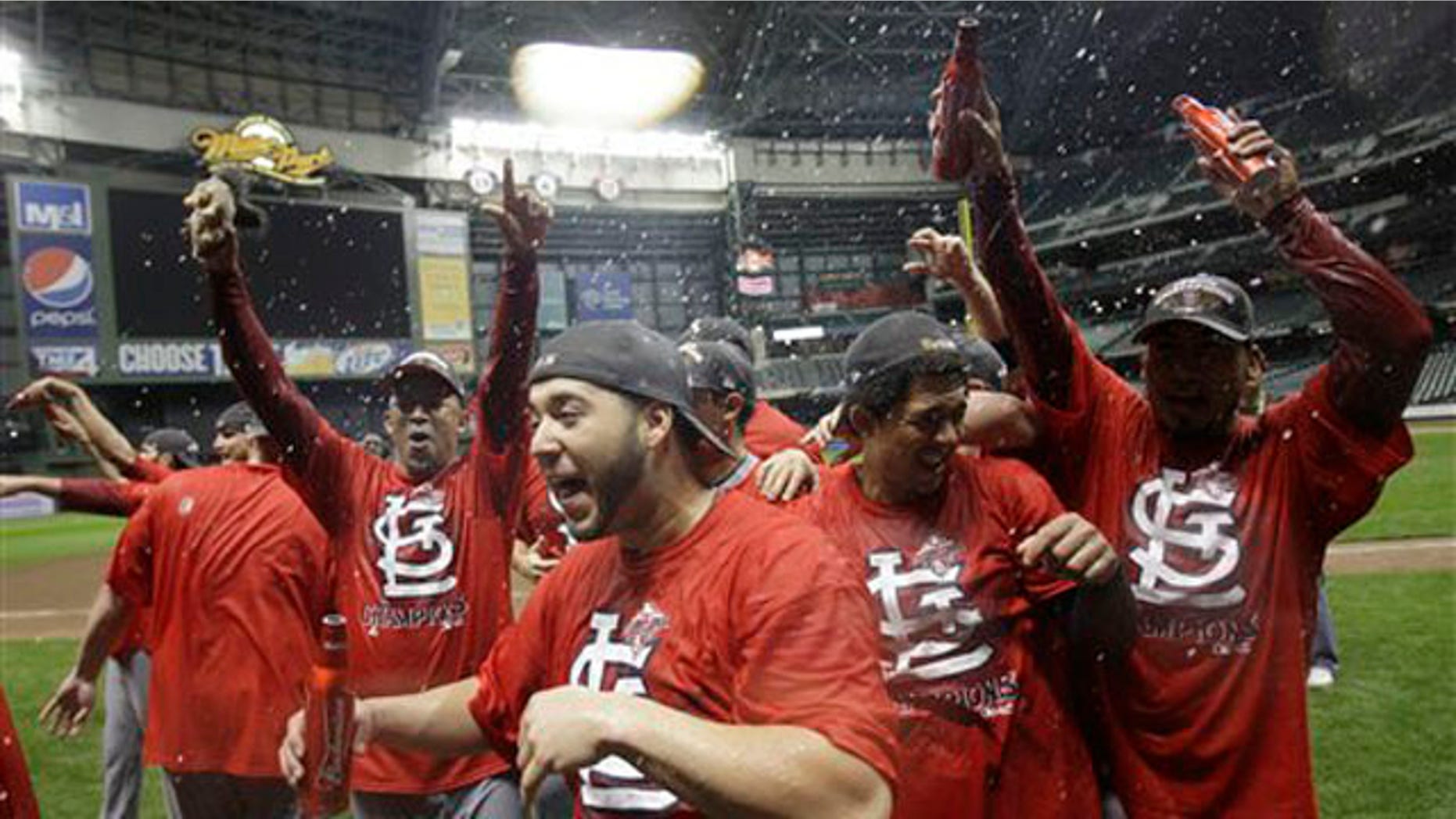 The St. Louis Cardinals celebrate after Game 6 of baseball's National League championship series against the Milwaukee Brewers Sunday, Oct. 16, 2011, in Milwaukee. The Cardinals won 12-6 to win the series and advance to the World Series. (AP Photo/David J. Phillip)