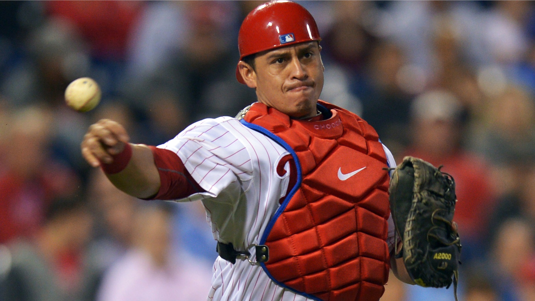 Carlos Ruiz #51 of the Philadelphia Phillies makes a throw to first base during the game against the Washington Nationals at Citizens Bank Park on September 25, 2012 in Philadelphia, Pennsylvania. (Photo by Drew Hallowell/Getty Images)