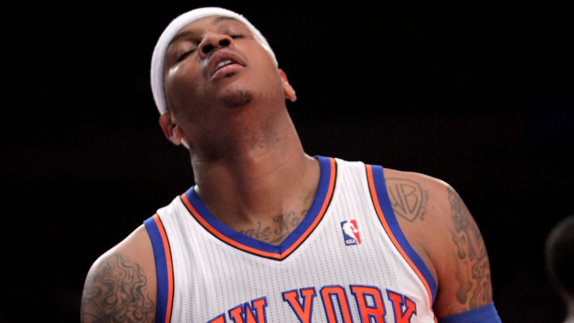 New York Knicks' Carmelo Anthony reacts after missing a shot during the first half of an NBA basketball game against the Philadelphia 76ers in New York, Sunday, March 11, 2012. The 76ers defeated the Knicks 106-94. (AP Photo/Seth Wenig)