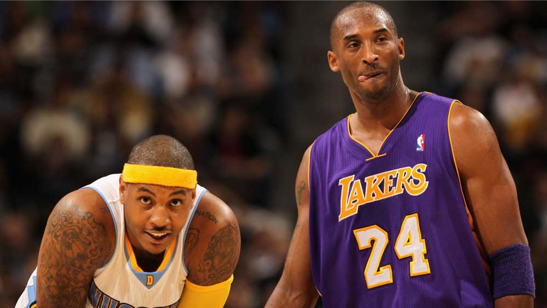 DENVER - NOVEMBER 11: Kobe Bryant #24 of the Los Angeles Lakers and Carmelo Anthony #15 of the Denver Nuggets look on during a break in the action at the Pepsi Center on November 11, 2010 in Denver, Colorado. The Nuggets defeated the Lakers 118-112. NOTE TO USER: User expressly acknowledges and agrees that, by downloading and/or using this Photograph, User is consenting to the terms and conditions of the Getty Images License Agreement. (Photo by Doug Pensinger/Getty Images)