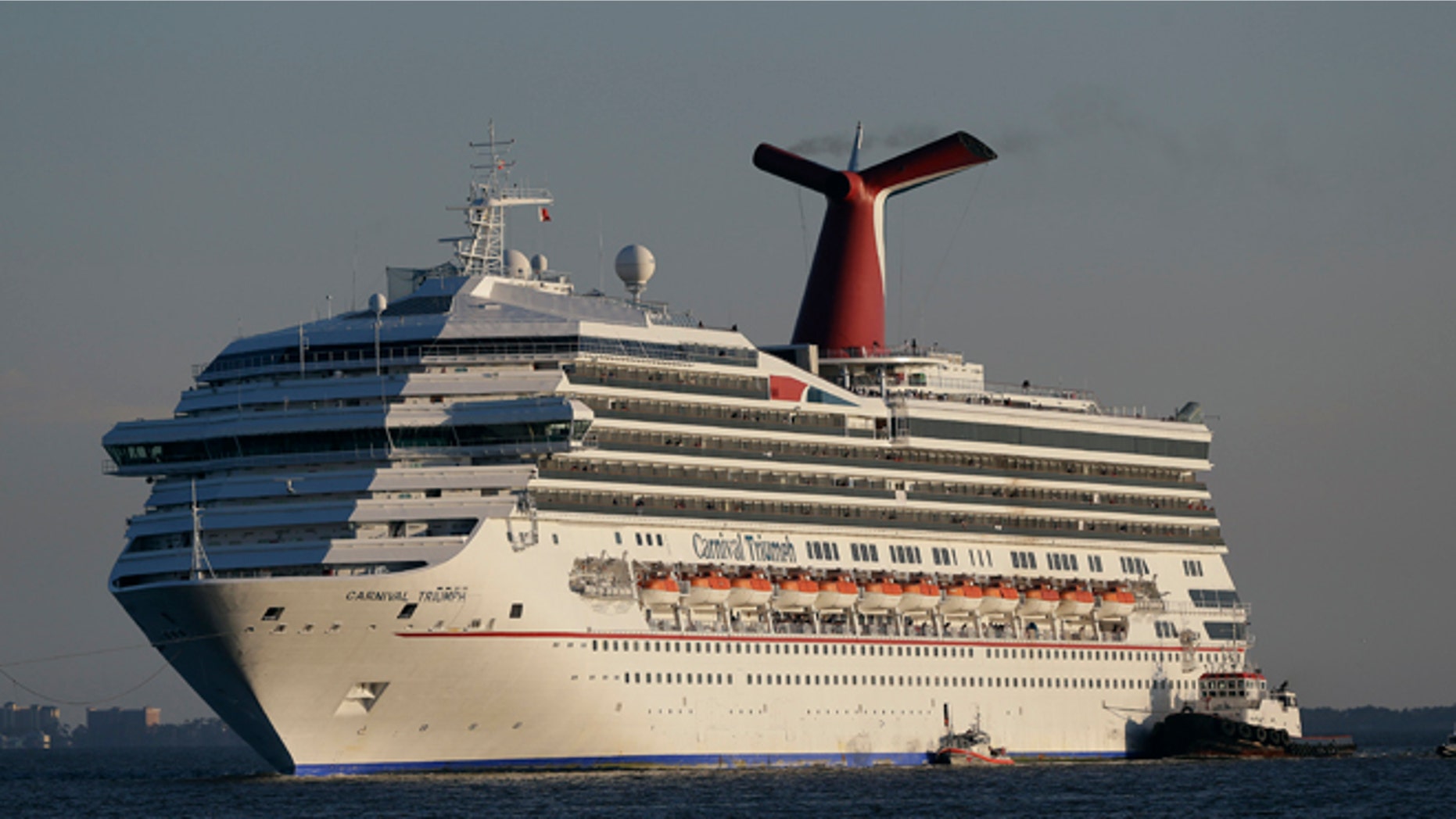 Feb. 14, 2013: In this file photo the cruise ship Carnival Triumph is towed into Mobile Bay near Dauphin Island, Ala.