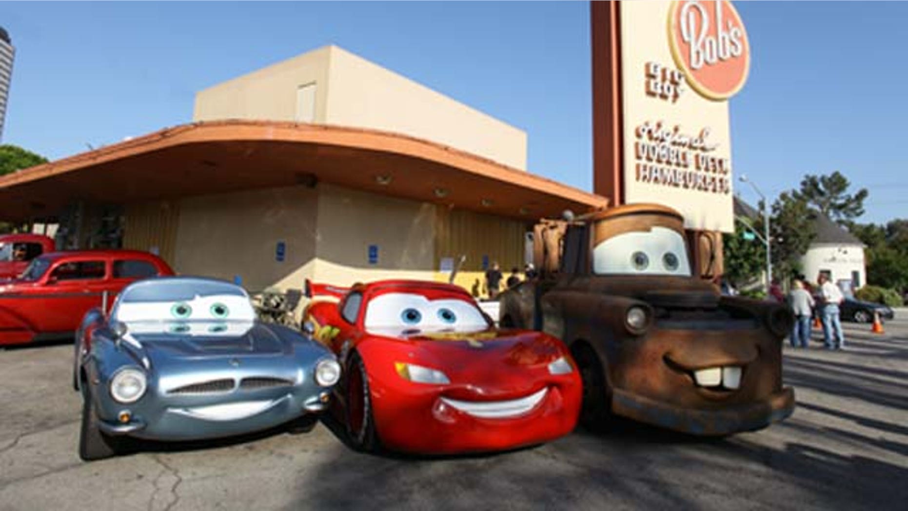 June 17, 2011: British spy Finn McMissile, four-time Piston Cup champion Lightning McQueen and his best pal Mater (life-size remote controlled models based on the characters) from Disney and Pixar's 'Cars 2' roll into Bob's Big Boy for a pit stop in Burbank, Calif.