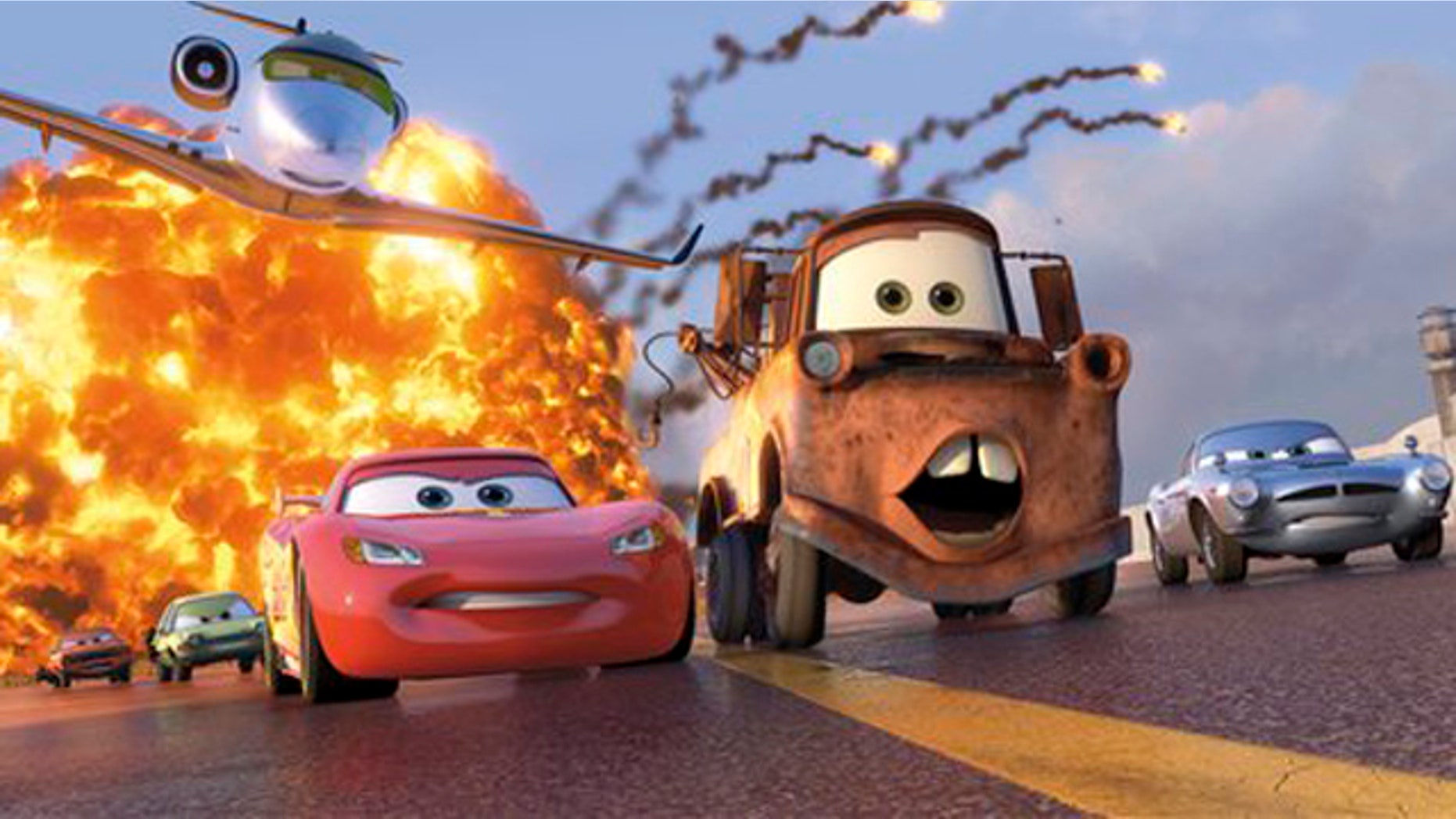 In this file film publicity image released by Disney-Pixar, animated characters Lightning McQueen, voiced by Owen Wilson, foreground left, Mater, voiced by Larry the Cable Guy, center, and Finn McMissile, voiced by Michael Caine, right, are shown in a scene from "Cars 2." "Cars 2" cruised to a No. 1 finish with a $68 million opening weekend, according to studio estimates Sunday, June 26, 2011. That makes 12 wins in a row for Pixar since 1995s Toy Story.