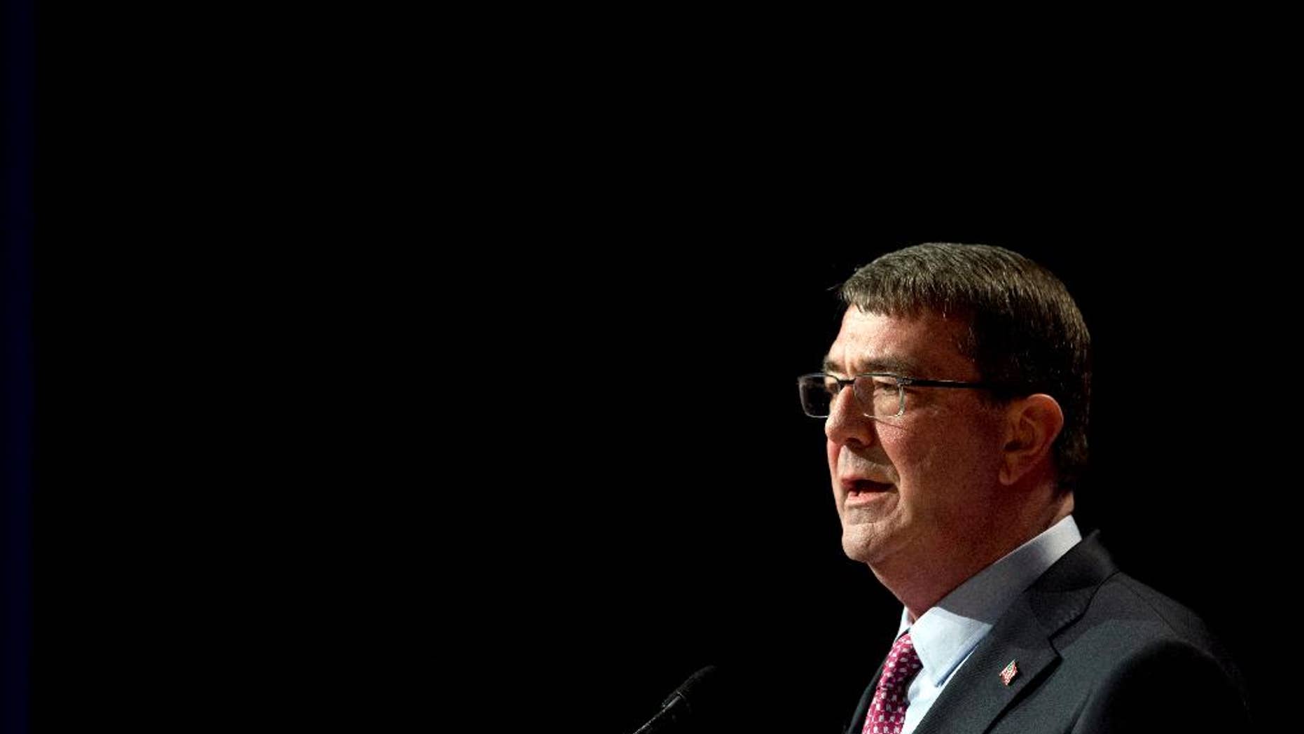 File-This March 6, 2015, file photo shows Defense Secretary Ash Carter, speaking during a ceremonial swearing-in ceremony at the Pentagon. Carter is considering easing some military enlistment standards as part of a broader set of initiatives to better attract and keep quality service members and civilians across the Defense Department. While there are few details yet, Carter is exploring whether to adjust some of the requirements for certain military jobs, such as those involving cyber or high-tech expertise. (AP Photo/Manuel Balce Ceneta)