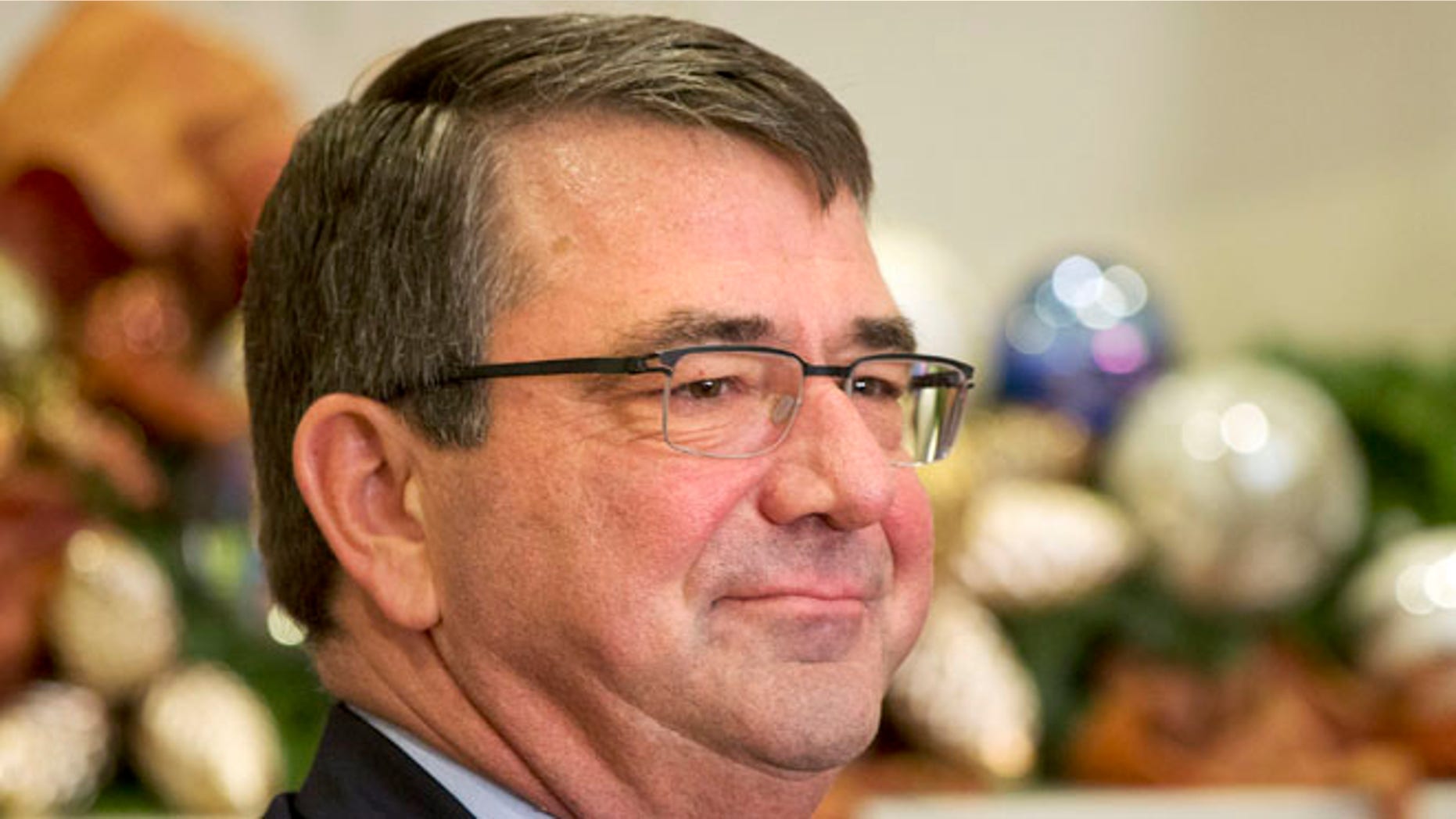 FILE: Dec. 5, 2014: Ashton Carter listen as President Obama announces him as his nominee to be Defense secretary, Roosevelt Room of the White House, Washington, D.C.