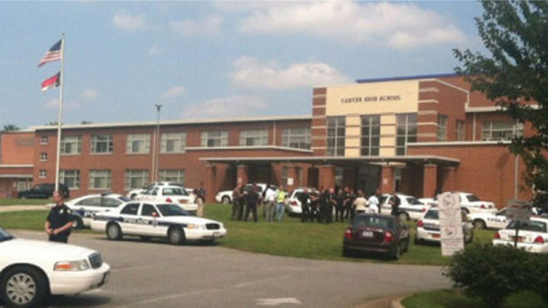 Aug 30, 2013: The scene outside Carver High School after reports of shots fired.