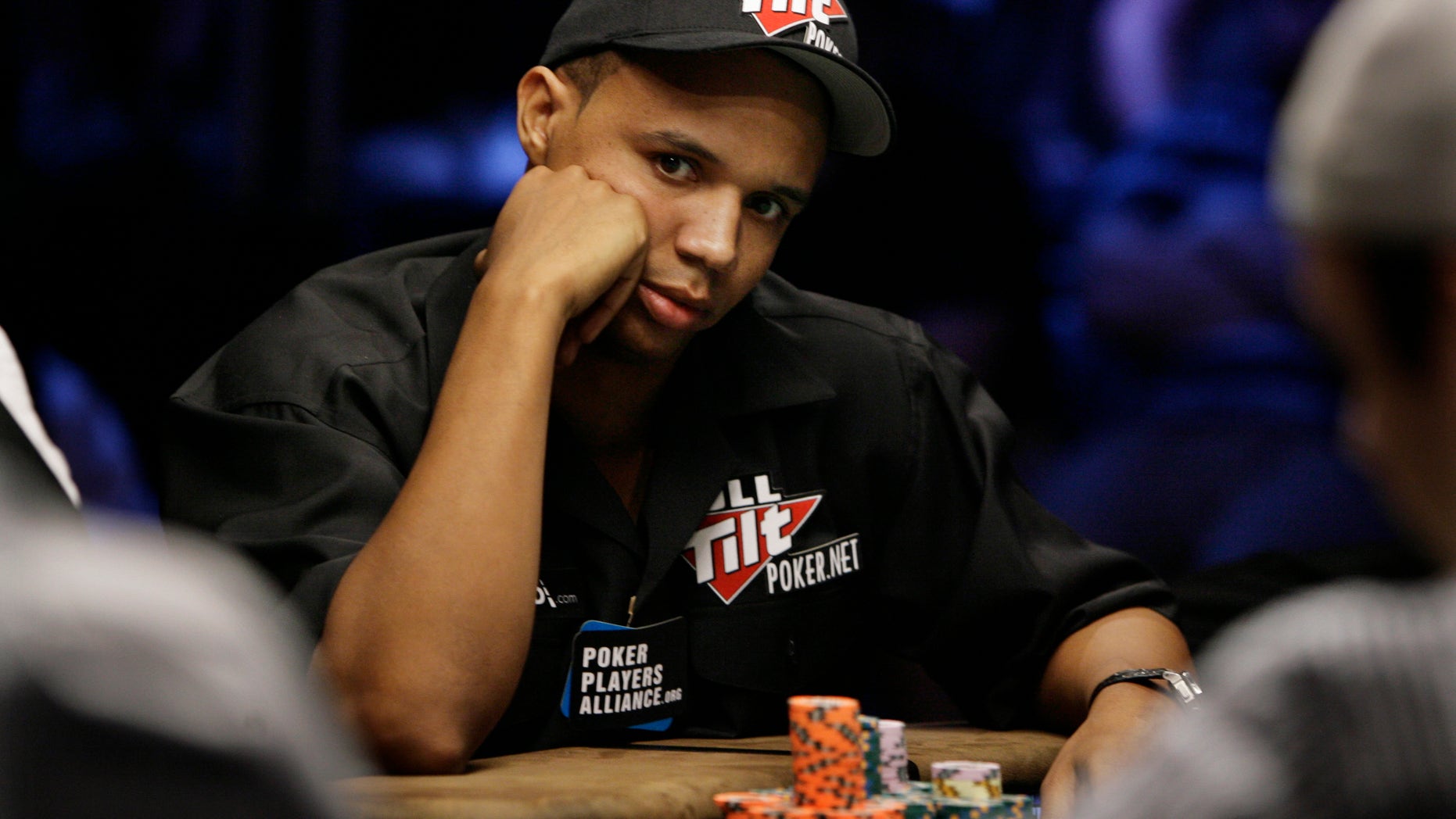 In this July 15, 2009 file photo, Phil Ivey looks up during the World Series of Poker at the Rio Hotel and Casino in Las Vegas.
