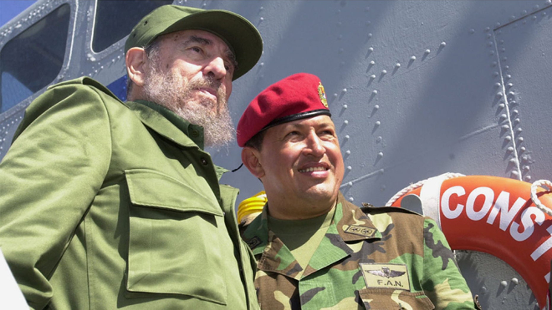 Cuban President Fidel Castro (L) and Venezuelan President Hugo Chavez travel onboard a Venezuelan Navy vessel from Porlamar to Pampatar prior a ceremony to promulgate a new Fishing Law, December 11, 2001 at Margarita Island, Venezuela. Castro is in Panpatar to attend the two-day meeting of the Association of Caribbean States (ACS). (Photo by Miraflores/Getty Images)