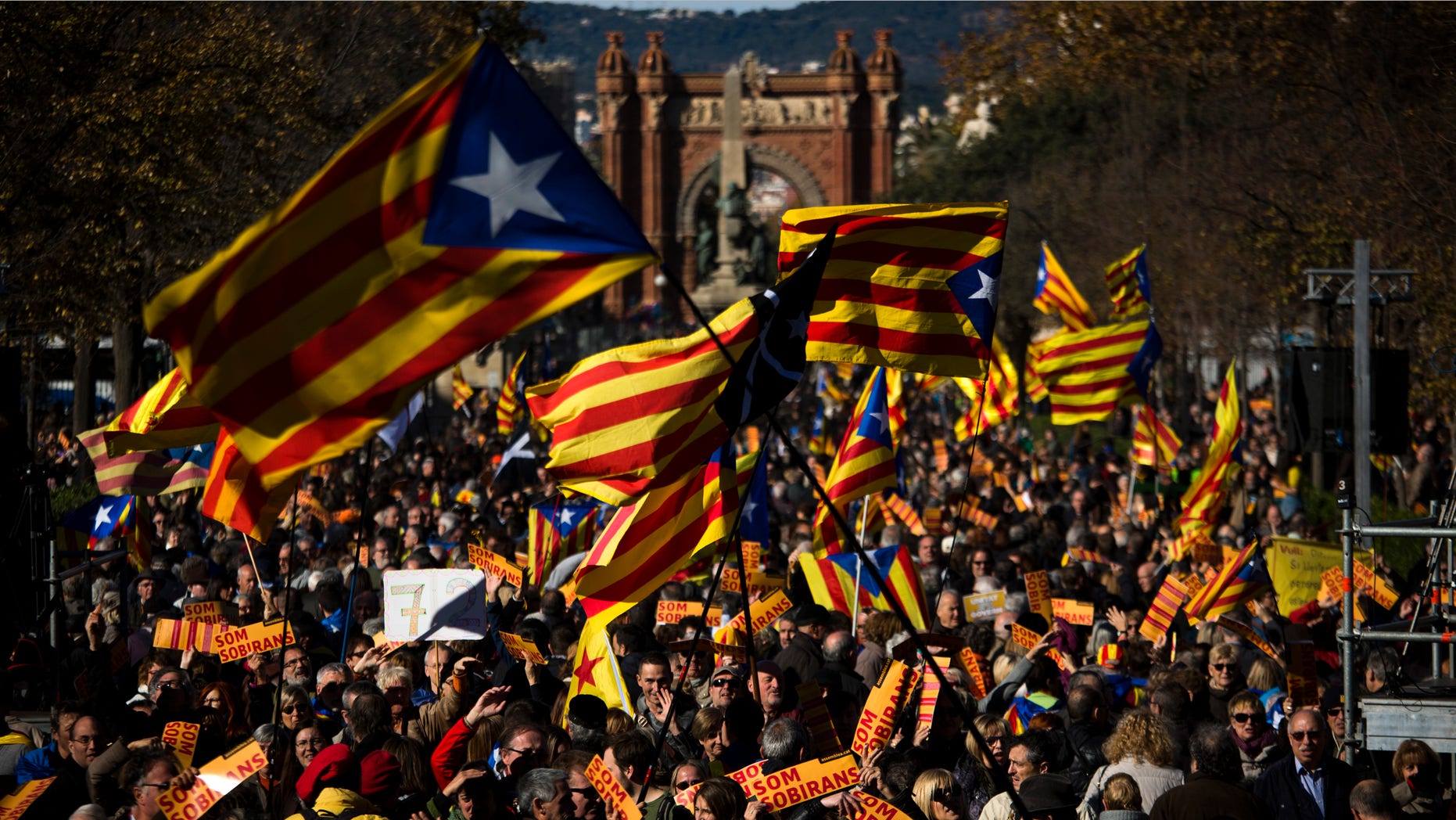 FILE - In this Nov. 22, 2015 file photo, pro Independence demonstrators wave "esteladas" or pro independence flags, during a demonstrations to show public support for the Parliament of Catalonia, in Barcelona, Spain. Spain's Constitutional Court has rejected a Catalan regional parliament resolution setting a road map for independence from Spain by 2017. In a sentence published Wed. Nov. 2, 2015, the court said the resolution adopted Nov. 9 by the Barcelona-based parliament violated five articles of the country's 1978 constitution and articles of the region's own statute. (AP Photo/Emilio Morenatti, File)