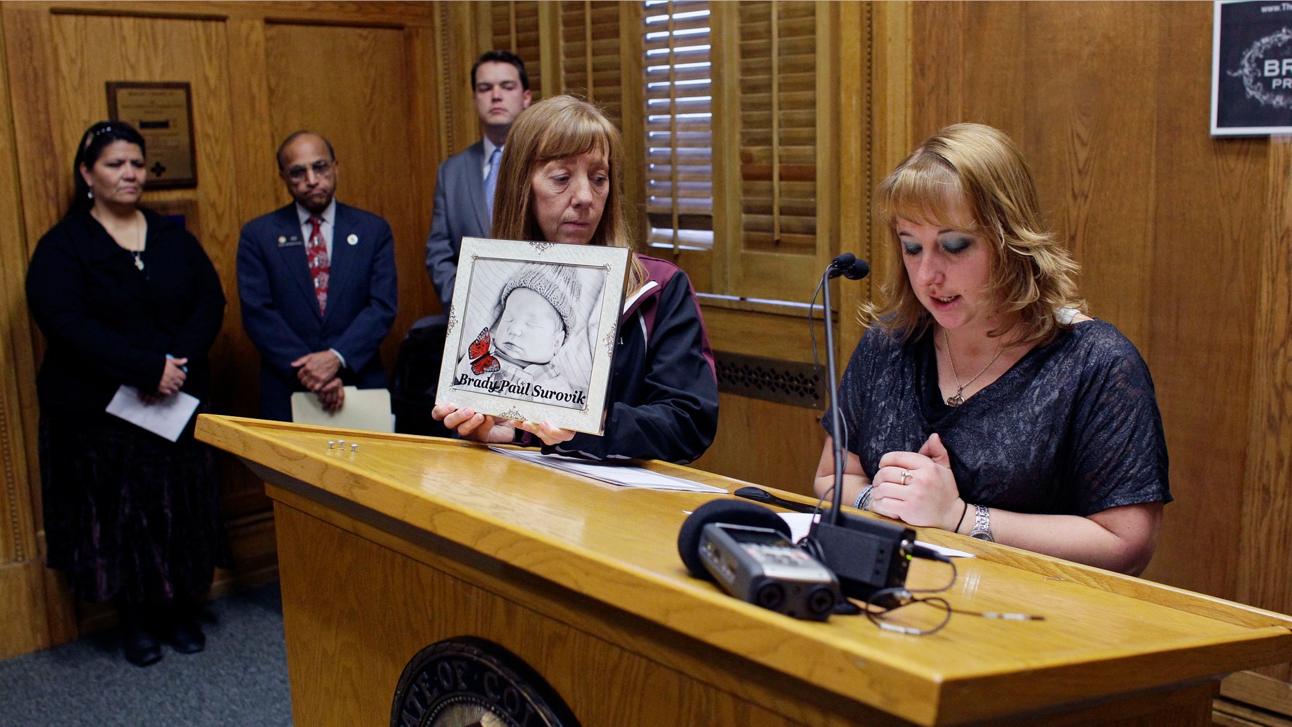 In this Monday, Jan. 28, 2013 photo, Heather Surovik, who lost her 8 1/2-month-old unborn son when her car was struck by drunken driver Gary Sheats in 2012, speaks at a news conference promoting a political drive to grant "personhood" status to unborn fetuses at the Colorado State Capitol in Denver.(AP Photo/Brennan Linsley)
