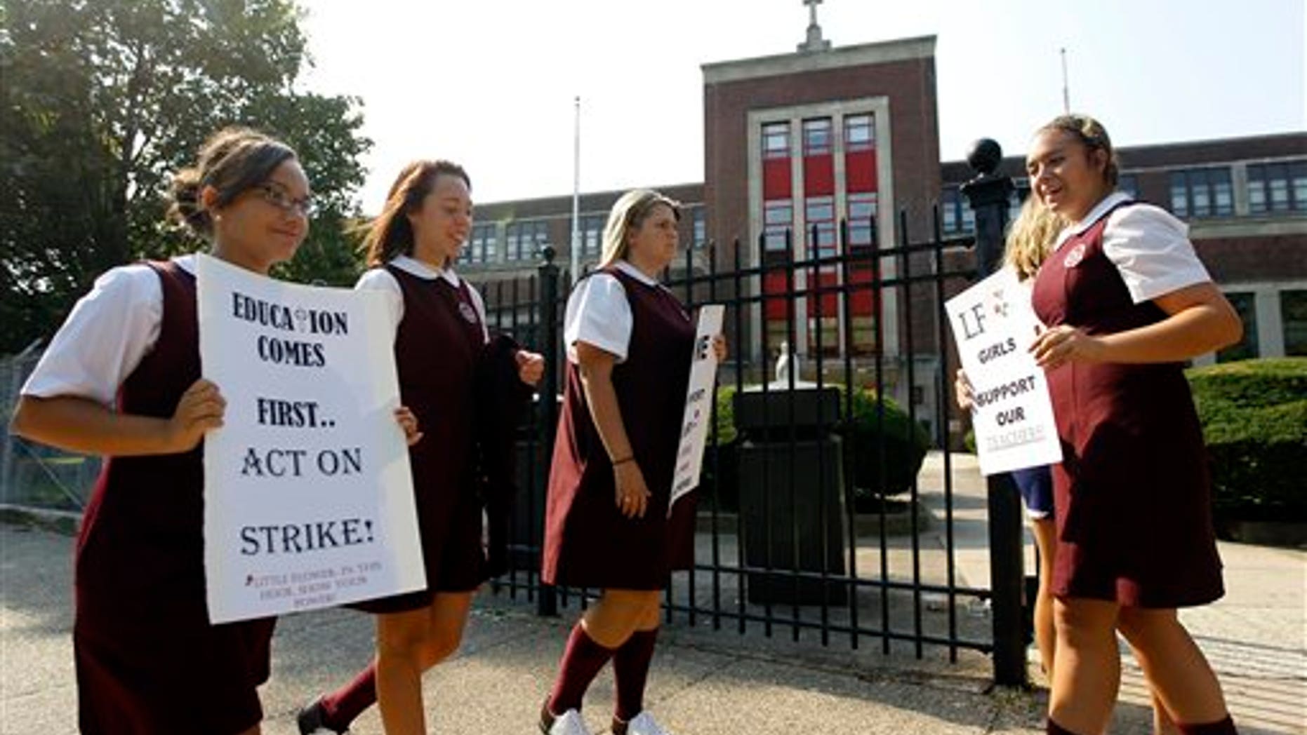 September 14: pport of their teachers outside Little Flower Catholic High School for Girls in Philadelphia.