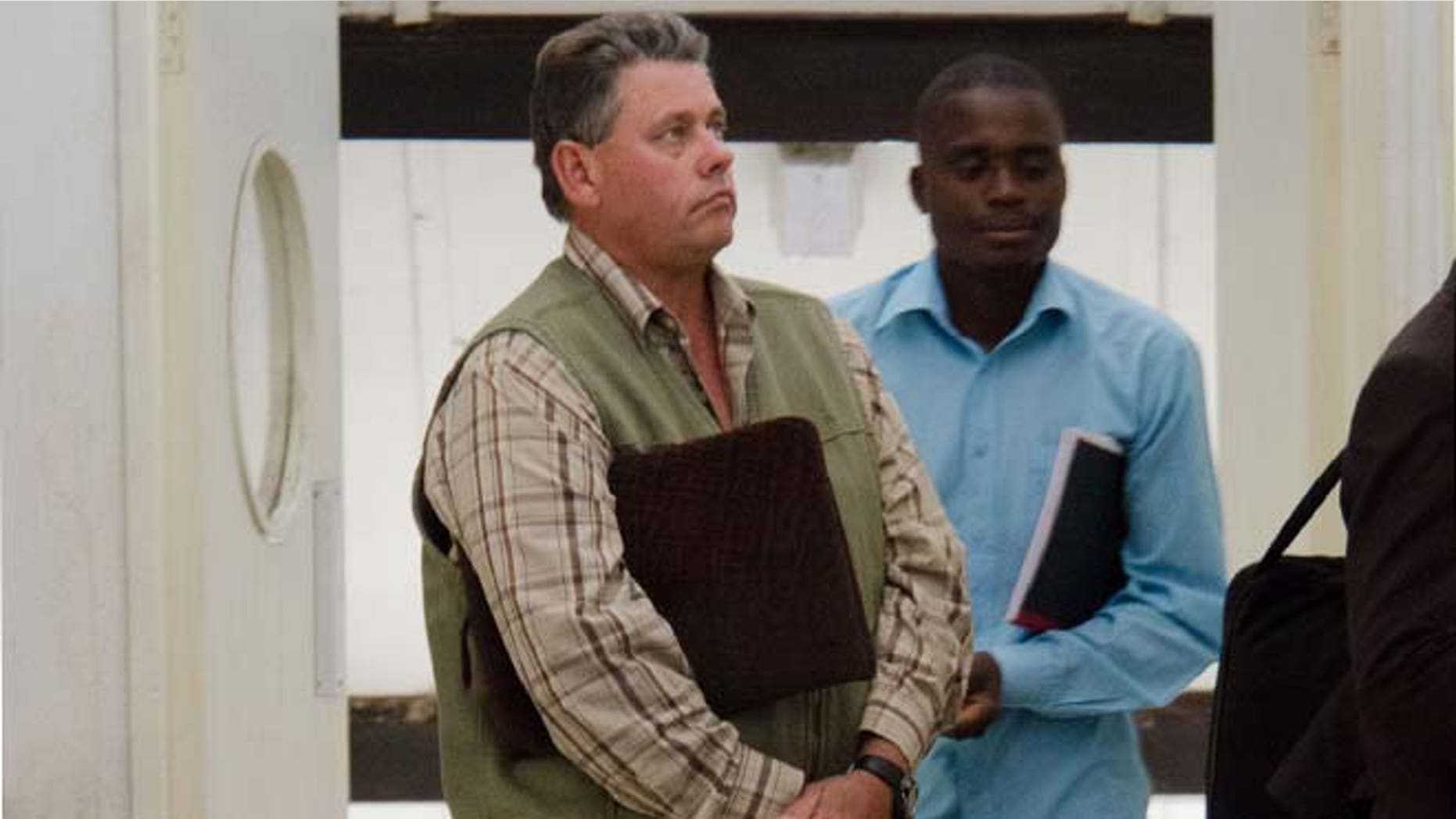July 29: Professional hunter Theo Bronkhorst appears at Hwange magistrates court to face poaching charges, about 435 miles west of the capital Harare.