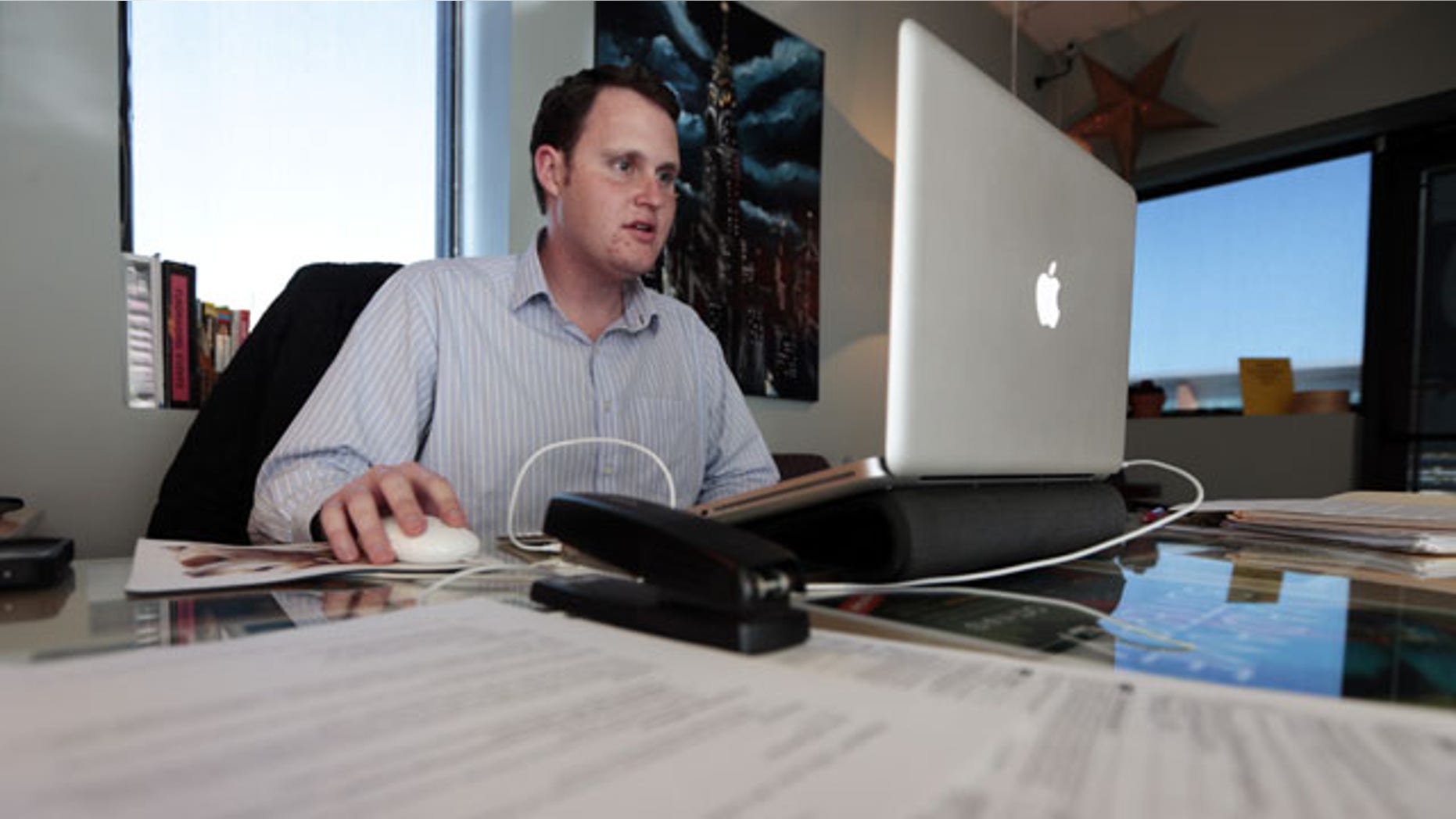 November 13, 2013: Jeremy Bills works at his job as associate director at the Nashville Education Community and Arts Television office in Nashville, Tenn. Bills, originally from Tampa, Fla., received his master's degree from Vanderbilt University in Nashville and has stayed in his college town while trying unsuccessfully to find a job in his field of study.After initial signs of recovery, U.S. mobility for young adults has fallen to the lowest level in more than 50 years. (AP Photo)