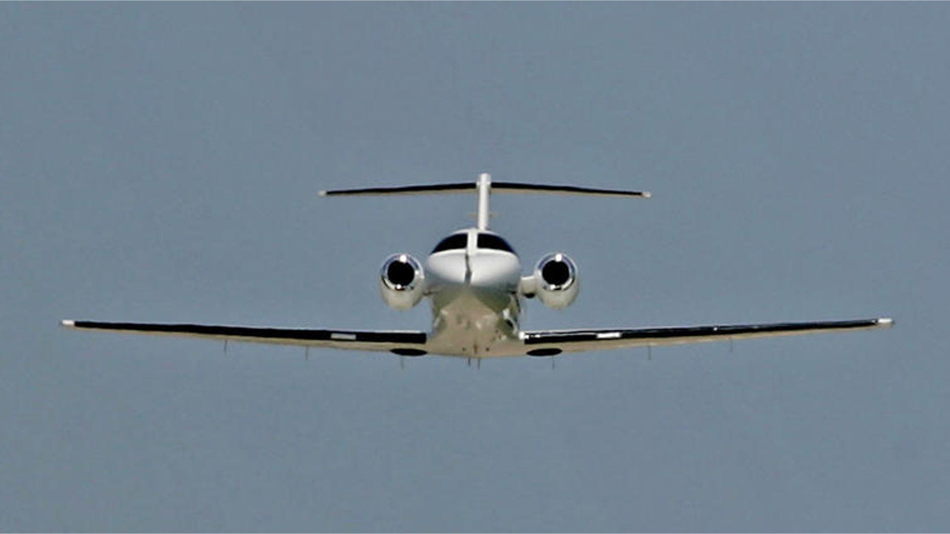 ** ADVANCE FOR WEEKEND EDITIONS, JUNE 25-26 ** A Cessna Citation Mustang business jet takes off for a test flight while a larger business jet comes in for a landing in the distance, June 15, 2005, in Wichita, Kan. Cessna has more than 200 orders for the entry-level business jet . (AP Photo/Charlie Riedel)