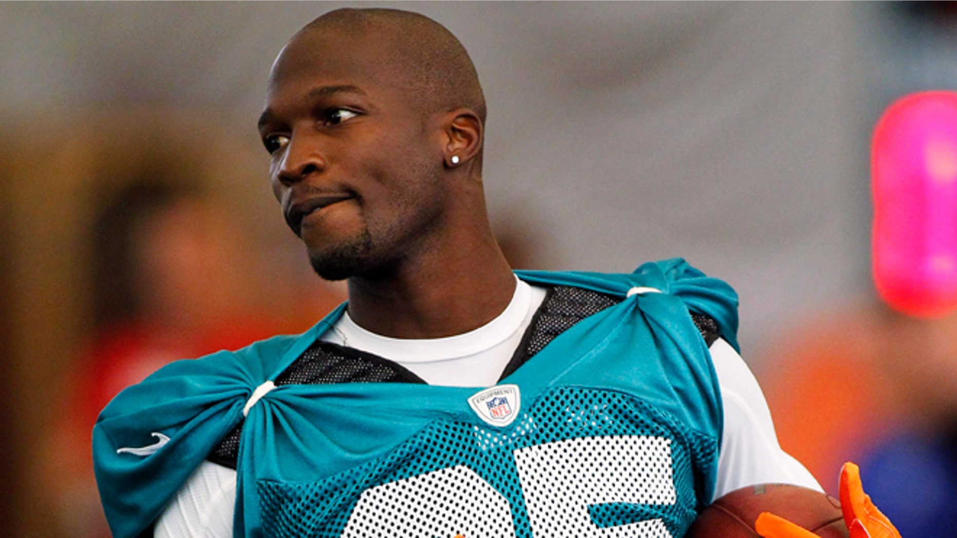 July 29, 2012: In this file photo, Miami Dolphins' Chad Johnson practices during NFL football training camp in Davie, Fla.