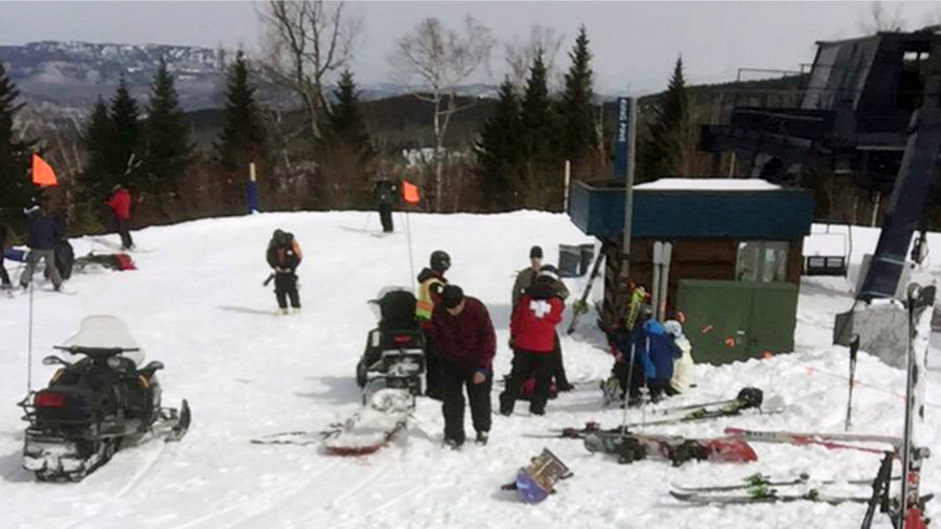 March 21, 2015: In this photo provided by Greg Hoffmeister, first aid is administered to injured skiers at Sugarloaf Mountain Resort after a chairlift accident in Carrabassett Valley, Maine. Seven people were hurt when an out-of-control chair lift at Sugarloaf ski resort stopped and then headed down the mountain backward, prompting riders to jump off, officials and witnesses said. (AP Photo/Greg Hoffmeister)