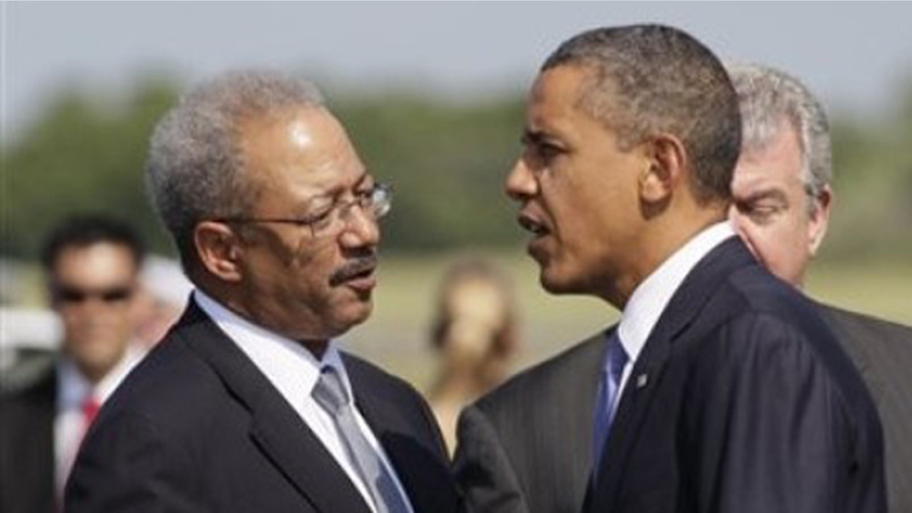 FILE: Rep. Chaka Fattah, D-Pa. talks with President Barack Obama as he steps off of Air Force One.