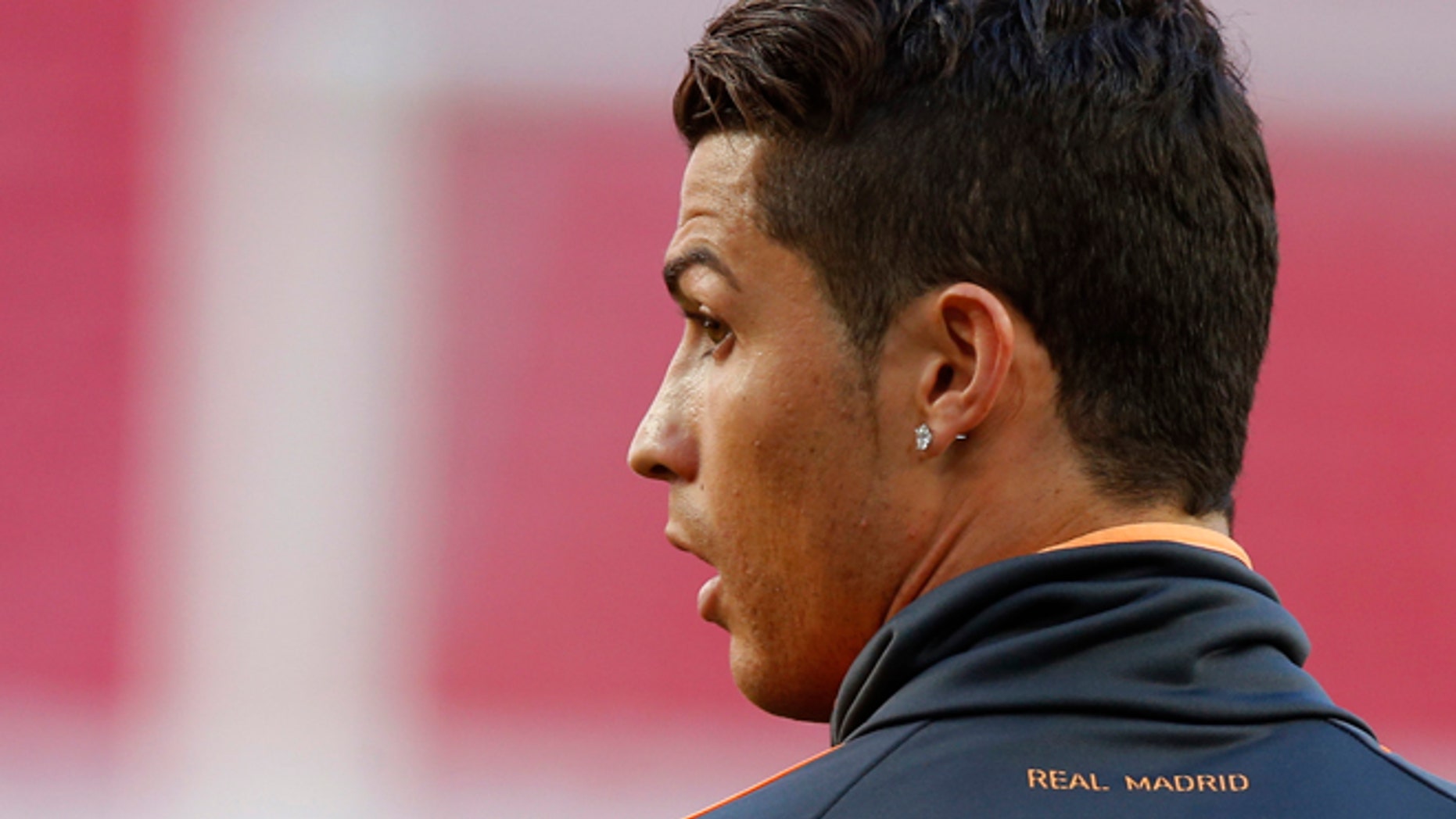 Real's Cristiano Ronaldo looks on, during a training session ahead of Saturday's Champions League final soccer match between Real Madrid and Atletico Madrid, in Luz stadium in Lisbon, Portugal, Friday, May 23, 2014. (AP Photo/Daniel Ochoa de Olza)