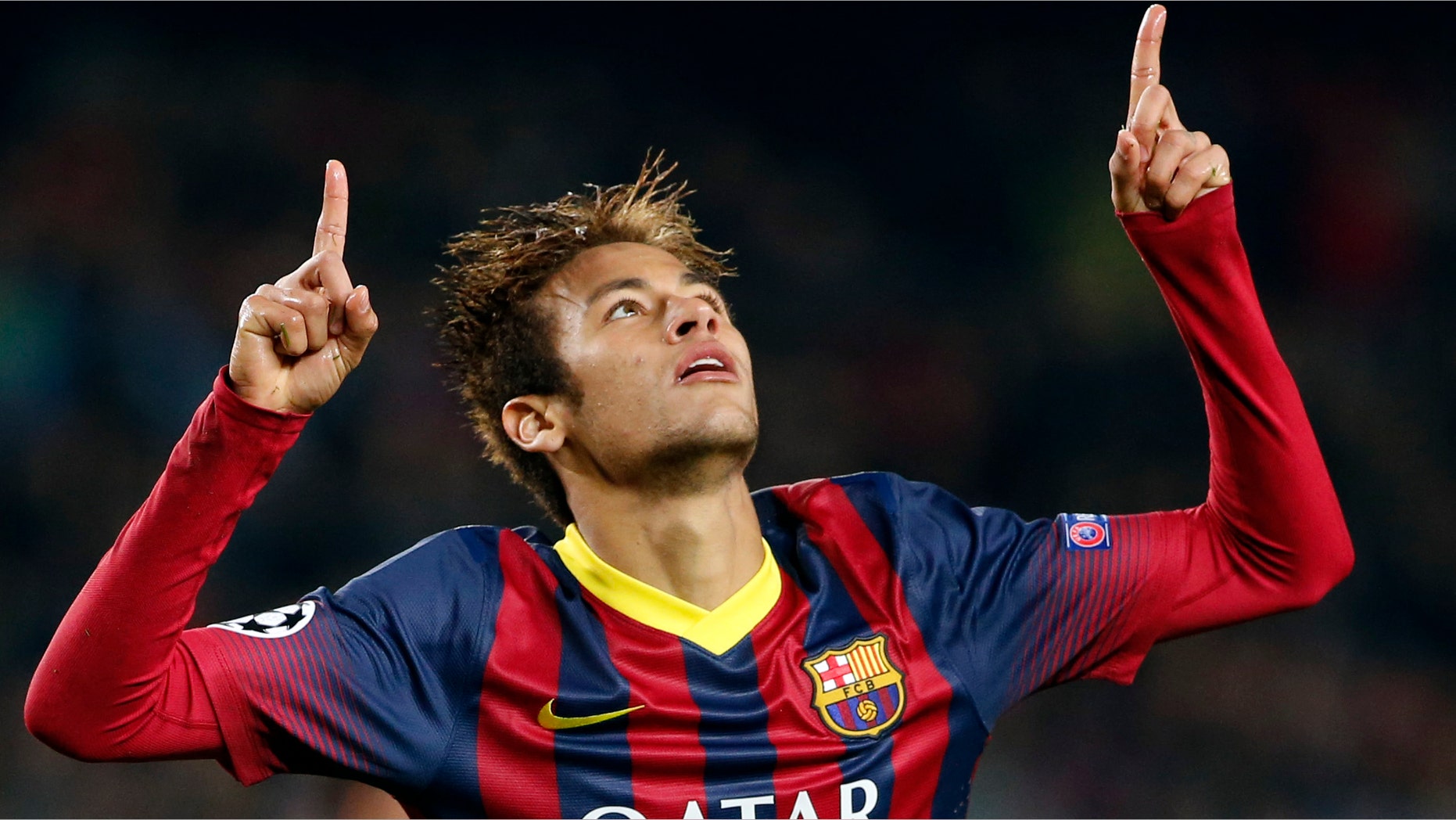 Barcelona's Neymar celebrates after scoring his side's fourth goal during a Group H Champions League soccer match between FC Barcelona and Celtic FC at the Camp Nou stadium in Barcelona, Spain, Wednesday Dec. 11, 2013.(AP Photo/Emilio Morenatti)