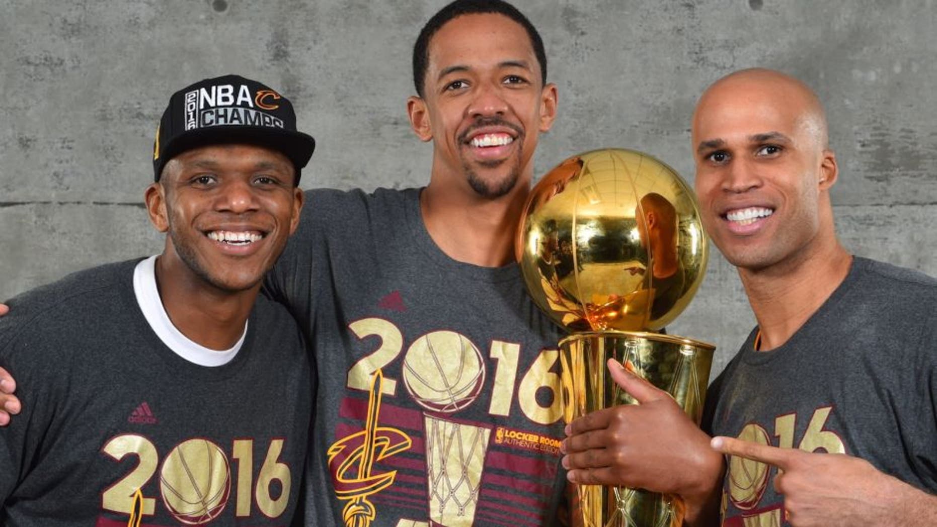 OAKLAND, CA - JUNE 19: James Jones #1, Channing Frye #9 and Richard Jefferson #24 of the Cleveland Cavaliers poses for a portrait after winning the NBA Championship against the Golden State Warriors during the 2016 NBA Finals Game Seven on June 19, 2016 at ORACLE Arena in Oakland, California. NOTE TO USER: User expressly acknowledges and agrees that, by downloading and or using this photograph, User is consenting to the terms and conditions of the Getty Images License Agreement. Mandatory Copyright Notice: Copyright 2016 NBAE (Photo by Jesse D. Garrabrant/NBAE via Getty Images)