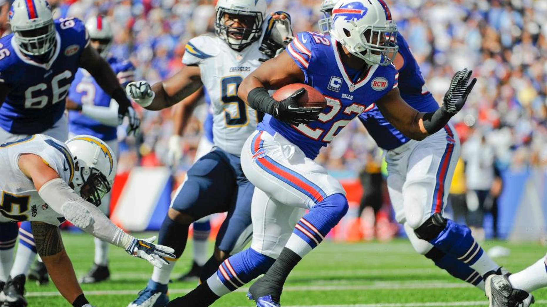 Buffalo Bills' Fred Jackson (22) rushes away from San Diego Chargers' Manti Te'o, left, for a touchdown during the second half of an NFL football game, Sunday, Sept. 21, 2014, in Orchard Park, N.Y. (AP Photo/Gary Wiepert)