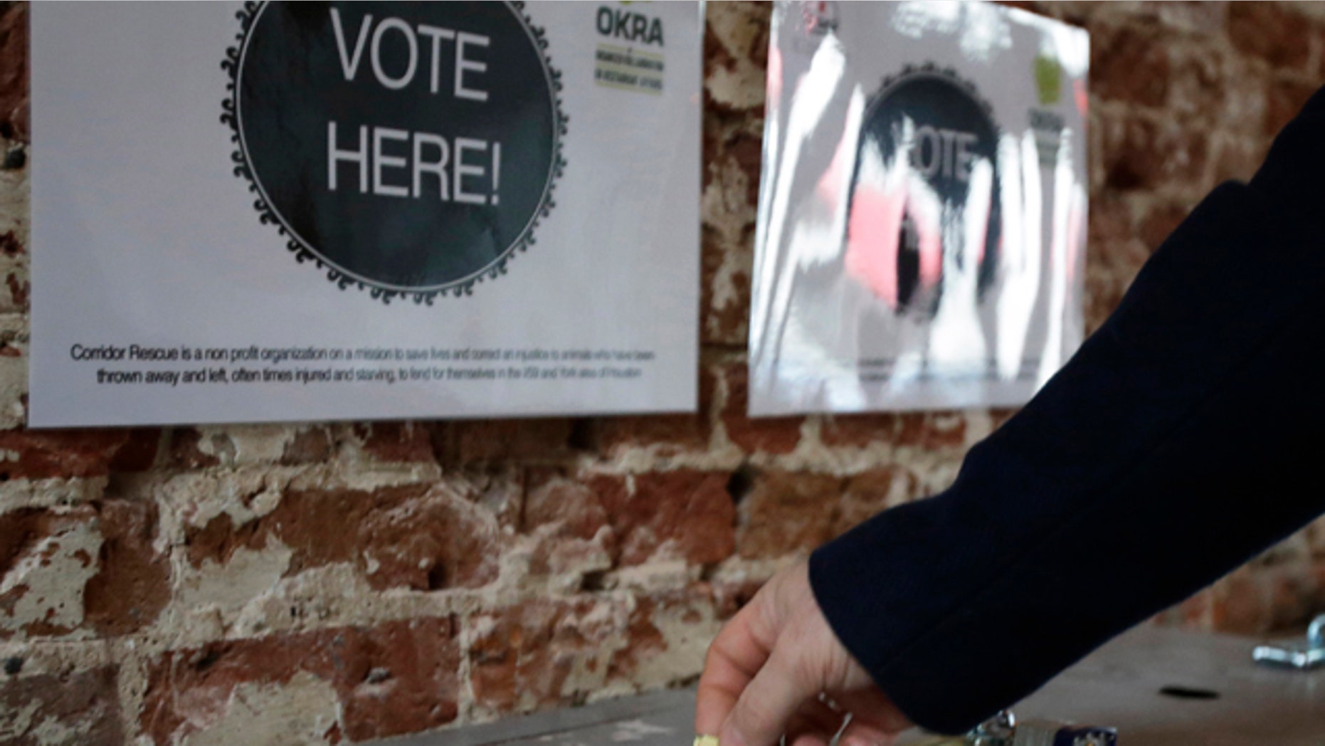 Jan. 16, 2013: A patron drops a ticket into a voting box at the Original OKRA Charity Saloon in Houston.