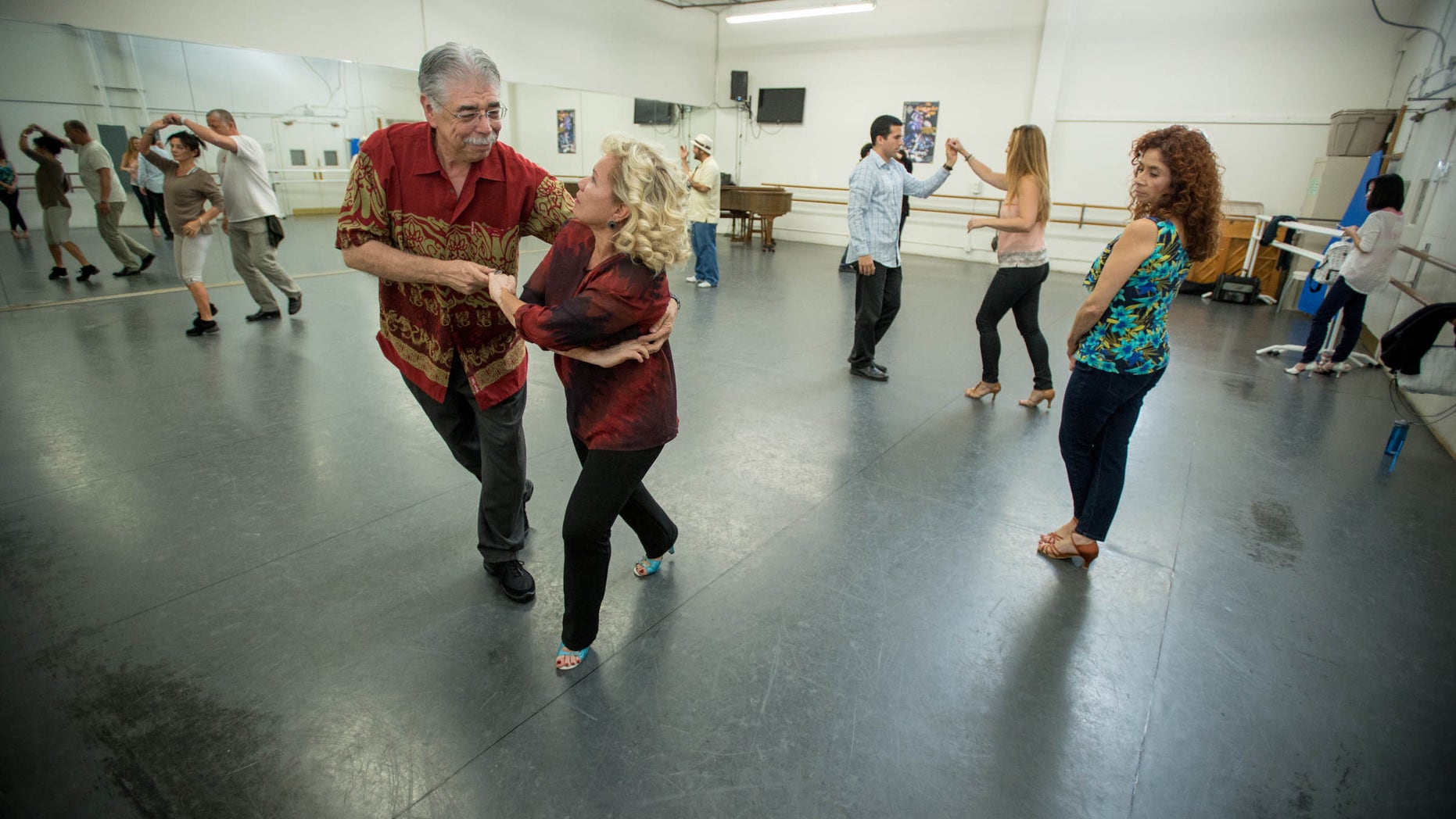 Charles Trevino, a patient at Cedars-Sinai Medical Center, and his wife Carmen during salsa dancing lessons at the Pasadena Dance Theatre, Thursday, Nov. 14, 2013. (Eric Reed/Cedars-Sinai Medical Center)