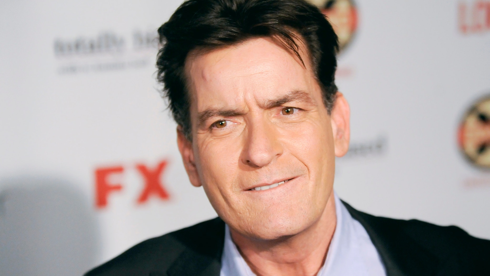 Actor Charlie Sheen arrives at the Hollywood FX Summer Comedies Party in Los Angeles, California June 26, 2012.