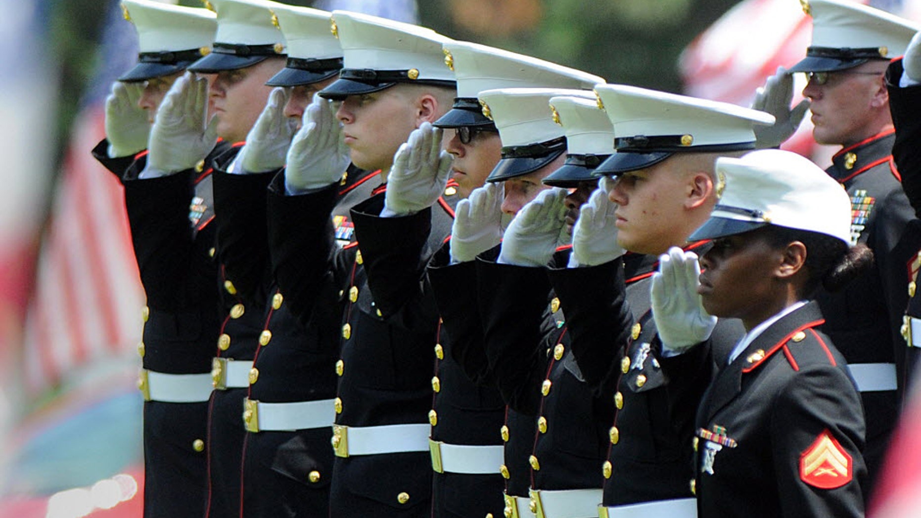 Marines give a final salute to Marine Gunnery Sgt. Thomas Sullivan during ceremony at the Massachusetts Veterans' Memorial Cemetery, Monday, July 27, 2015, in Agawam, Mass. Sullivan was one of five service members killed by a gunman in Chattanooga, Tenn. on July 16. The gunman was killed by police. (Don Tregger/The Republican via AP, Pool)