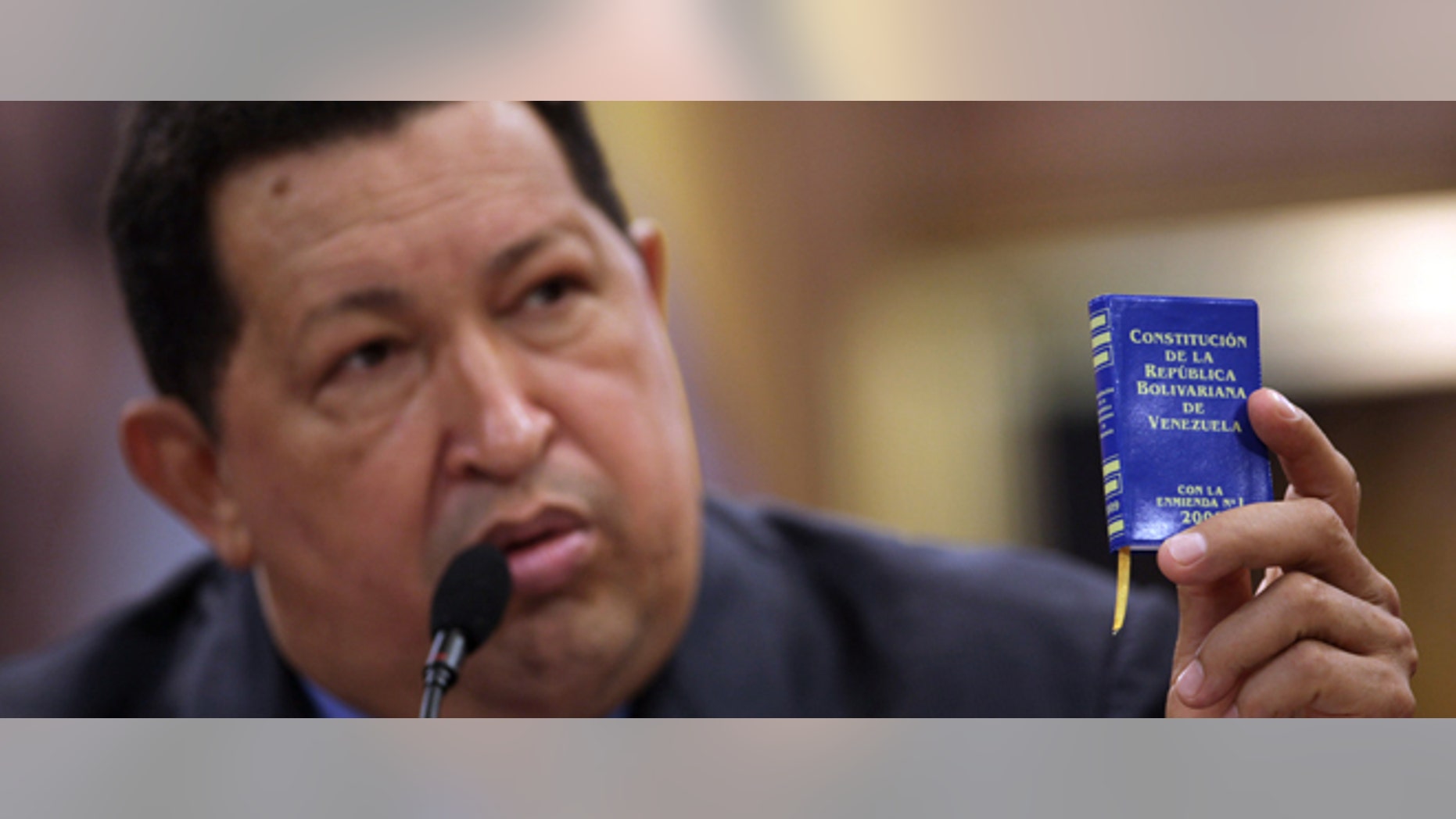FILE - In this Oct 9, 2012 file photo, Venezuelaâs President Hugo Chavez holds a miniature copy of his country's constitution during a news conference in Caracas, Venezuela. The ailing president's health crisis has raised contentious questions ahead of the swearing-in set for Jan. 10, including whether the inauguration could legally be postponed. Officials have raised the possibility that Chavez might not be well enough to take the oath of office, without saying what will happen if he can't. The constitution says that if a president or president-elect dies or is declared unable to continue in office, presidential powers should be held temporarily by the president of the National Assembly and that a new presidential vote should be held within 30 days. (AP Photo/Rodrigo Abd, File)