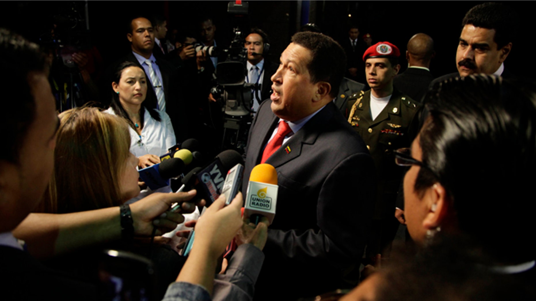 Venezuela's President Hugo Chavez speaks with journalists after a meeting with a Brazilian commission at Miraflores presidential palace in Caracas, Venezuela, Wednesday, July 25, 2012. Chavez met with a Brazilian commission to talk about entry of Venezuela to Mercosur, the largest trading bloc in South America. (AP Photo/Ariana Cubillos)