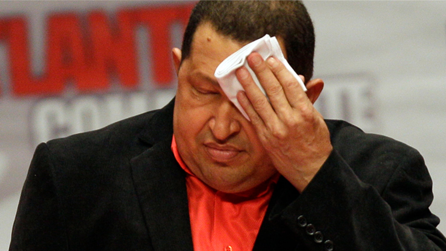 Feb. 23: President Hugo Chavez wipes his forehead as he attends a concert in his honor at the Teresa Carreno Theater in Caracas, Venezuela.