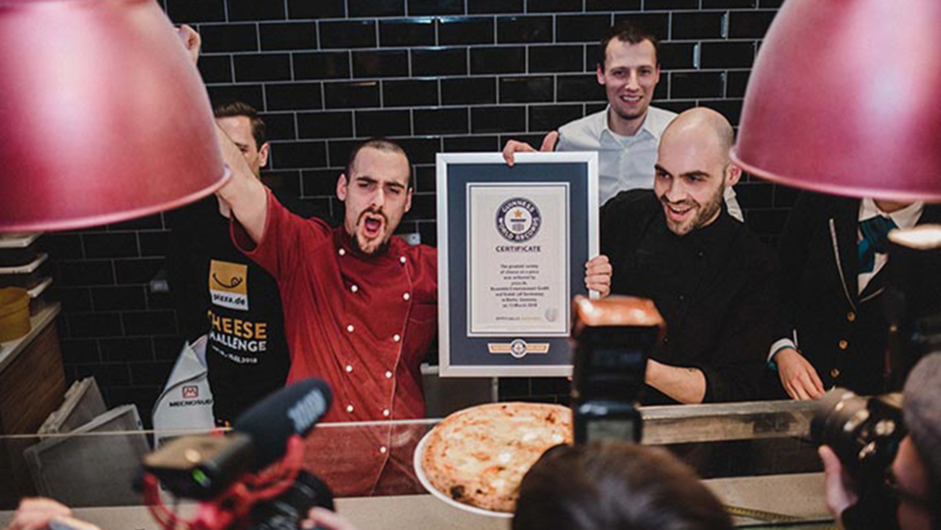 An American chef has crafted a record-breaking pizza by using 111 different types of cheese.