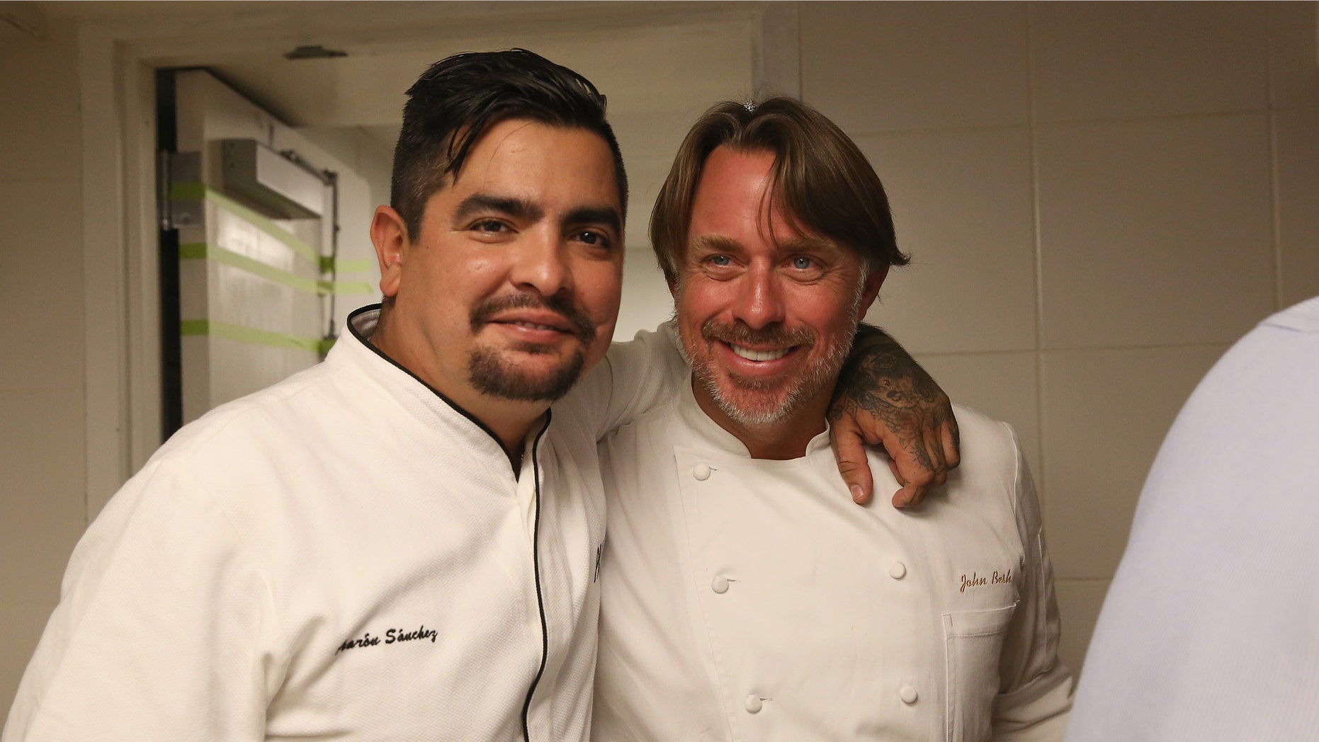 NEW YORK, NY - OCTOBER 16: Chefs Aaron Sanchez (L) and John Besh pose at the Johnny Sanchez Dinner hosted by John Besh, Aaron Sanchez and Katy Sparks as a part of the Bank of America Dinner Series during the Food Network New York City Wine & Food Festival Presented By FOOD & WINE at Tavern On The Green on October 16, 2014 in New York City. (Photo by Mireya Acierto/Getty Images for NYCWFF)