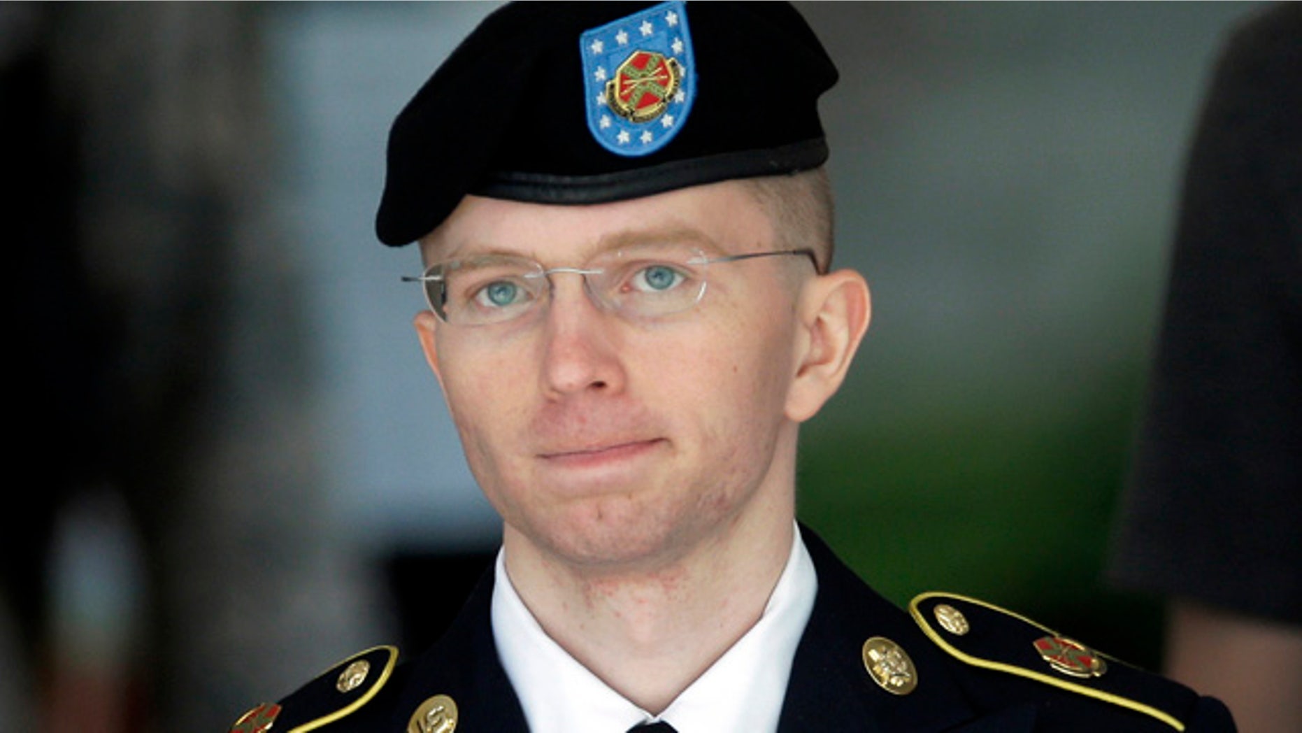 FILE - In this June 5, 2013, file photo Army Pvt. Chelsea Manning, then-Army Pfc. Bradley Manning, is escorted out of a courthouse in Fort Meade, Md., after the third day of his court martial. (AP Photo/Patrick Semansky, File)