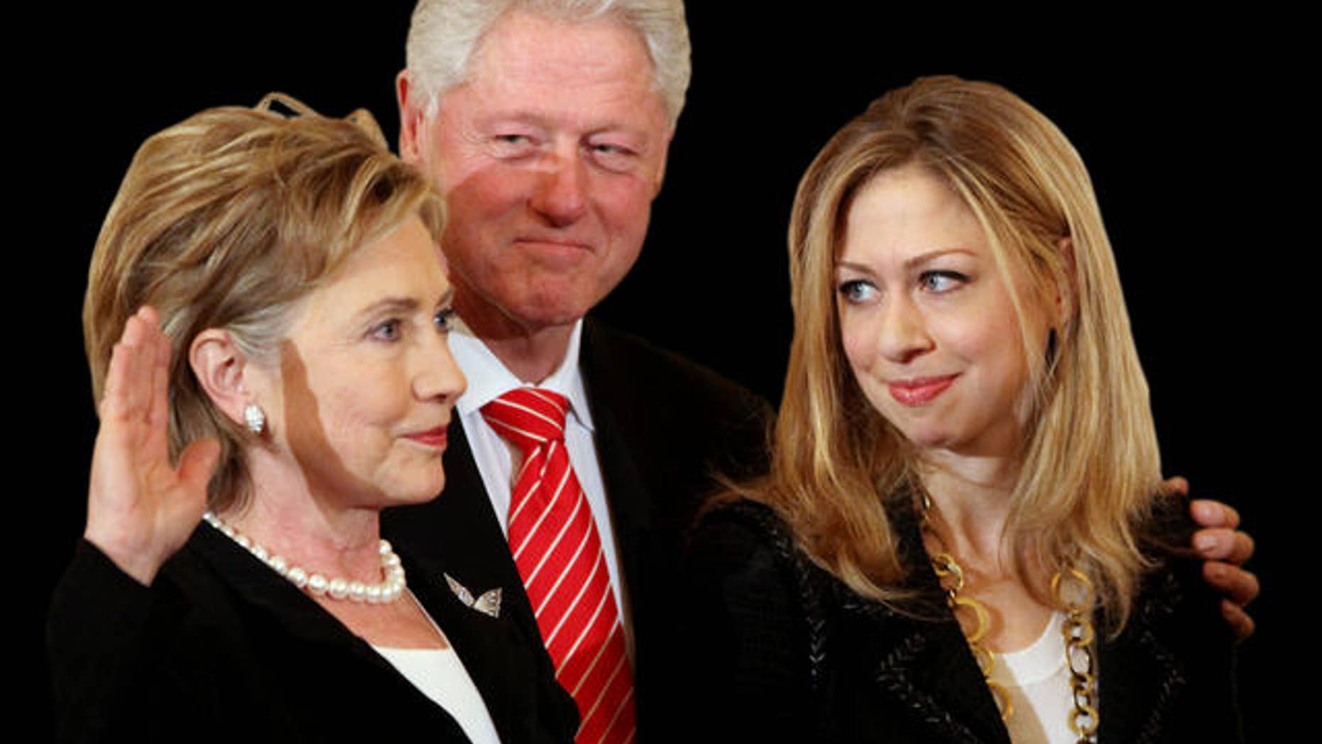 Former President Bill Clinton, center, and daughter Chelsea Clinton, right, look on during a ceremonial swearing-in for Secretary of State Hillary Rodham Clinton, Monday, Feb. 2, 2009, at the State Department in Washington. (AP Photo/Haraz N. Ghanbari)