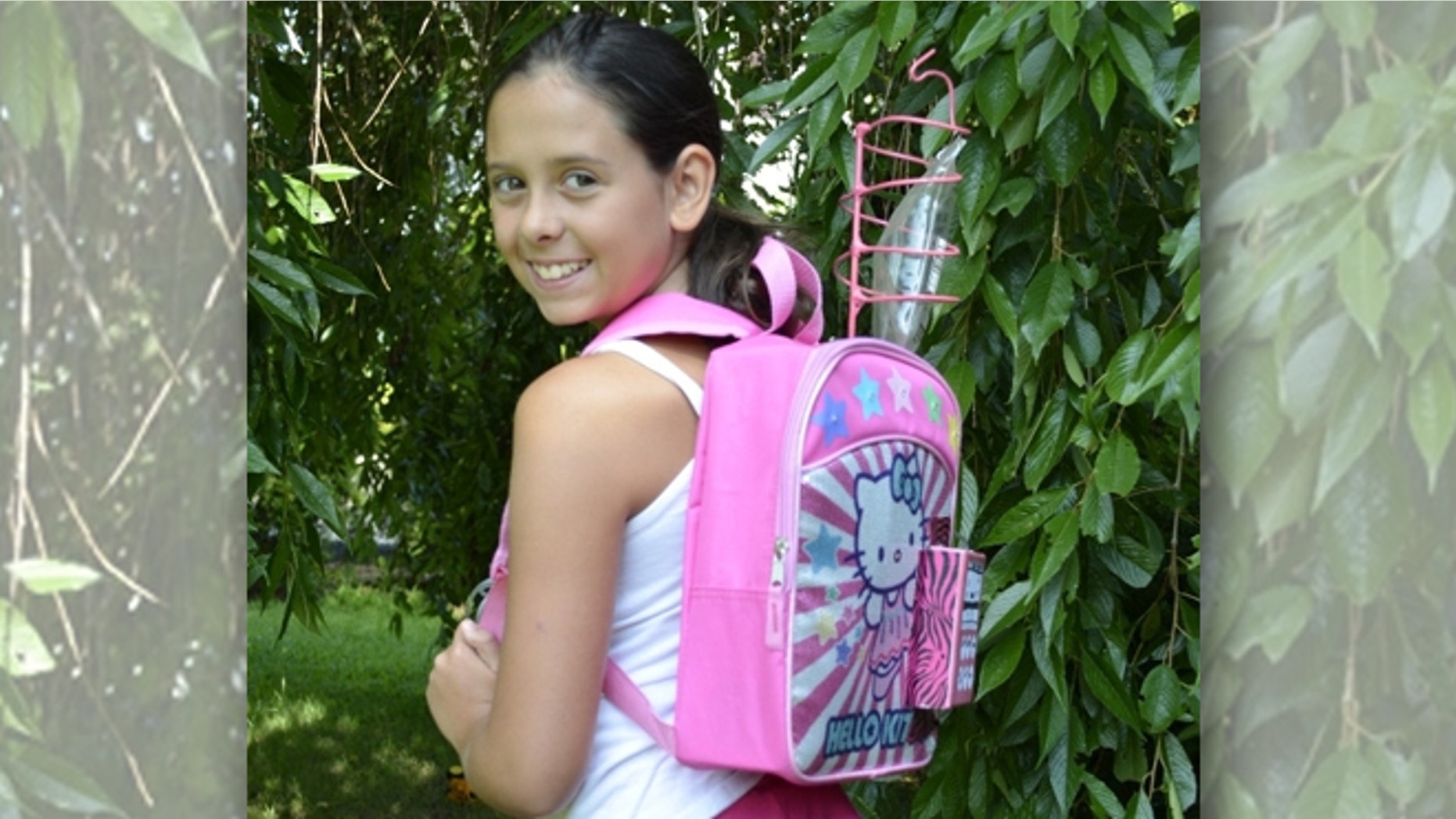 Kylie Simonds, 11, of Naugatuck, Conn., shows off her "chemo backpack" for WTNH News 8 reporters.