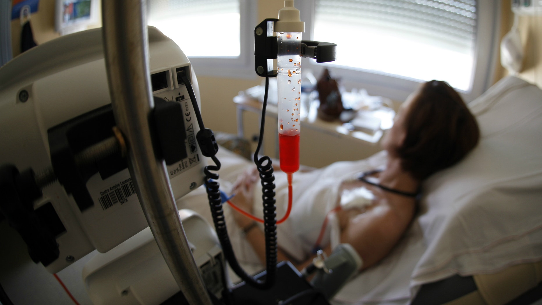 A patient receives chemotherapy treatment for breast cancer.