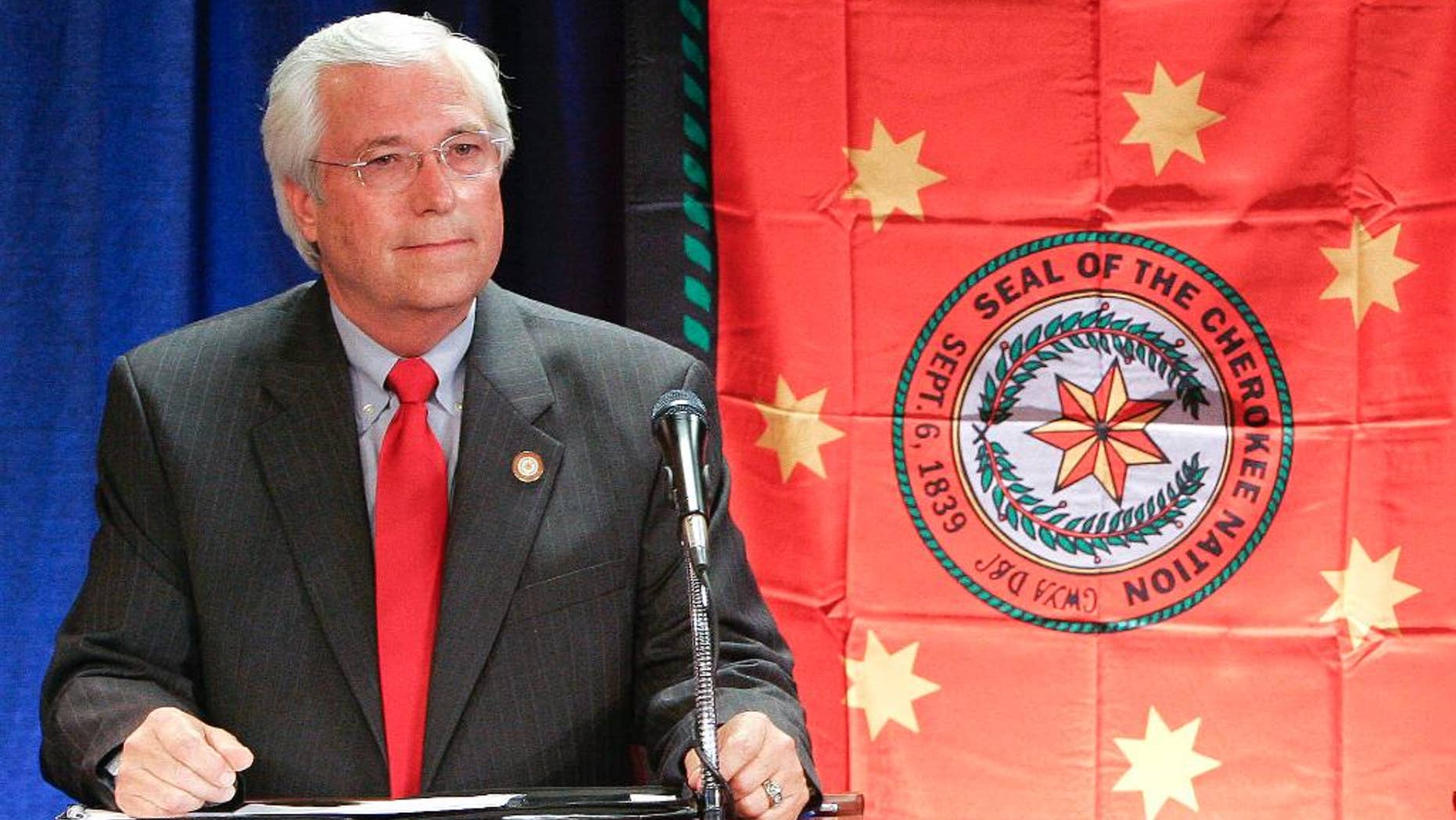 FILE - In this June 6, 2011, file photo, Bill John Baker waits for a debate in Claremore, Okla. The Cherokee Nation re-elected Baker as principal chief on Sunday, June 28, 2015, according to preliminary results, calming concerns that a four-candidate field would result in another tumultuous election to lead one of the largest American Indian tribes. (AP Photo/David Crenshaw, File)