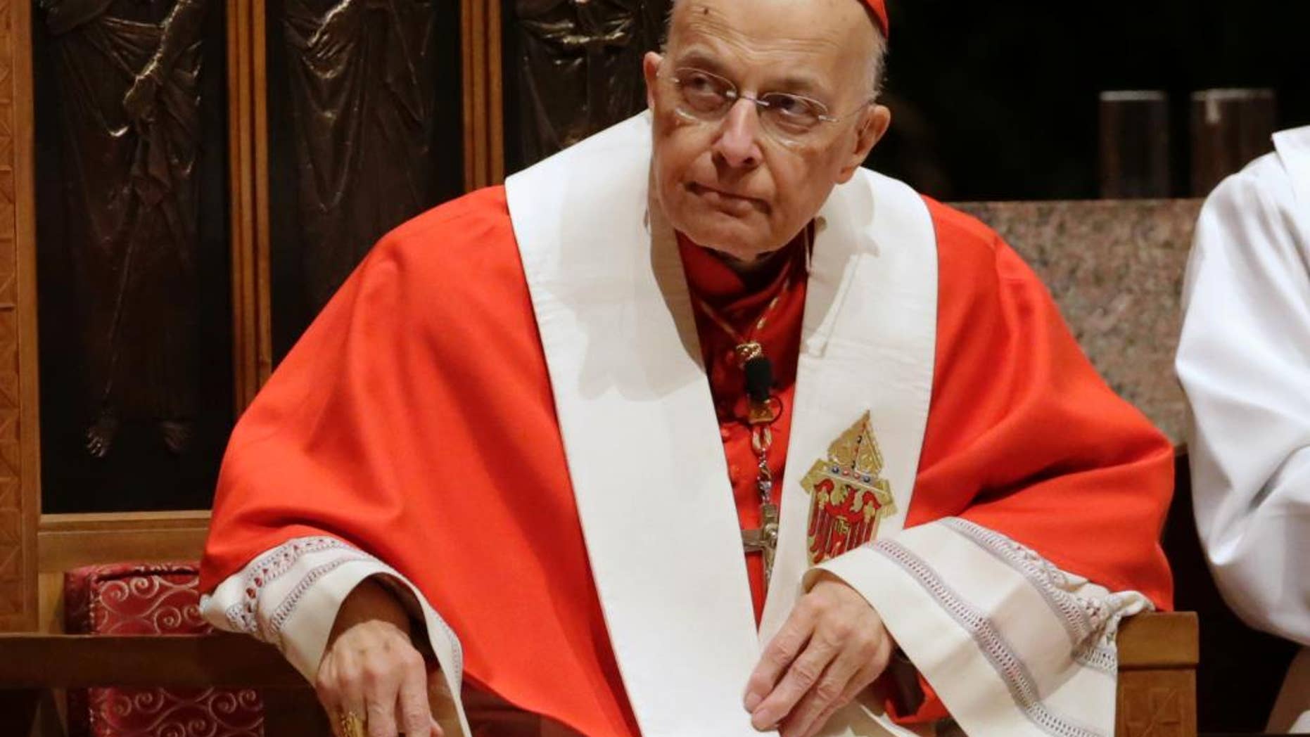 FILE - In this Nov. 17, 2014 file photo, retiring Cardinal Francis George listens at Holy Name Cathedral in Chicago during Bishop Blase Cupich's Rite of Reception service. The Archdiocese of Chicago said Tuesday, March 3, 2015, that George was admitted to the hospital Sunday, March 1, for evaluation after he stopped treatment for kidney cancer more than a month ago. Archdiocese officials say he'll stay there several days while tests are done. (AP Photo/Charles Rex Arbogast, File)