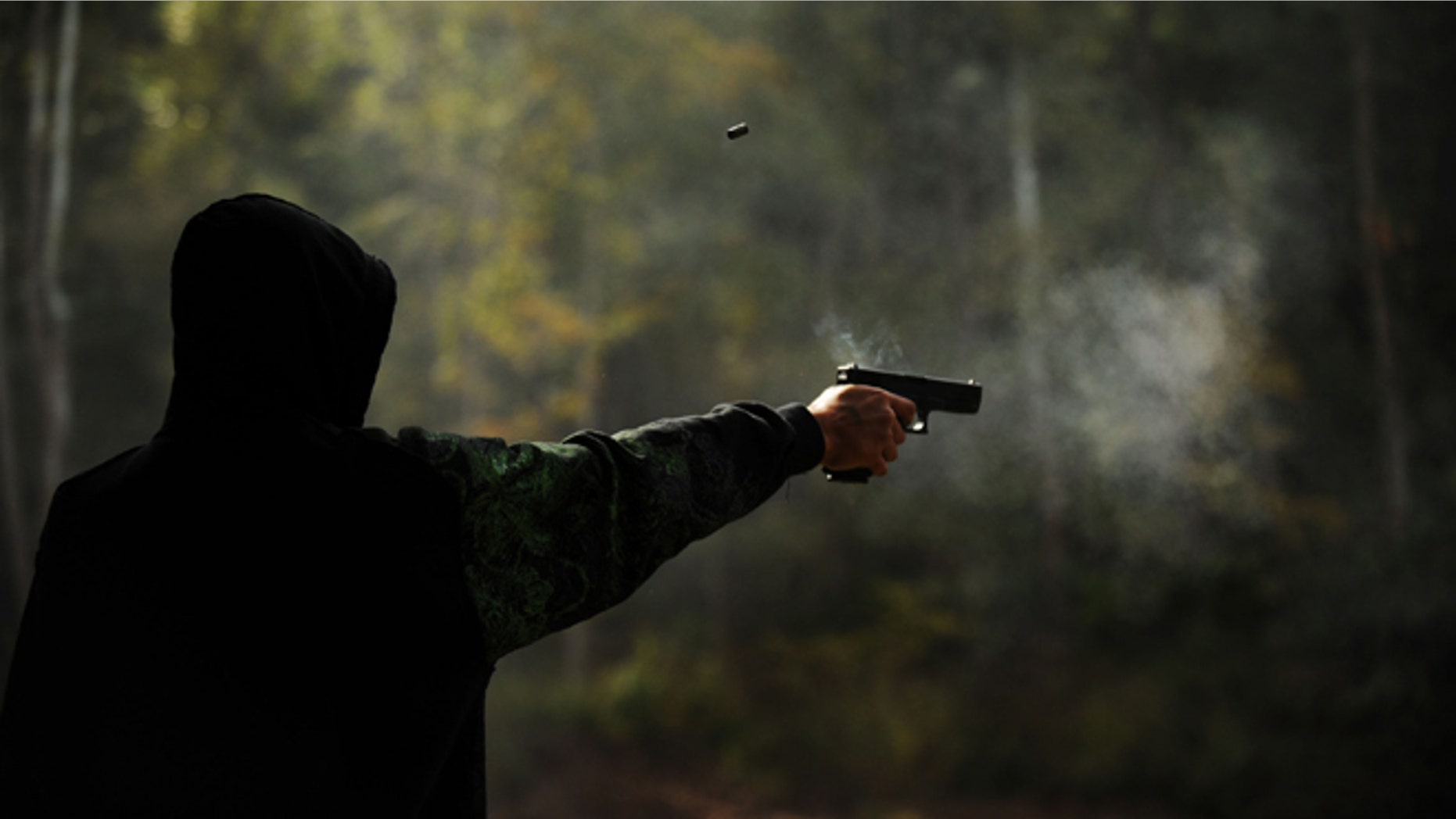 WEST POINT, KY - OCTOBER 10: Alex Soballe, 17, of Chicago, Ill. shoots a 9mm handgun at the Knob Creek Machine Gun Shoot on October 10, 2009 in West Point, Kentucky. The Supreme Court is currently hearing a portion of last year's Second Amendment case, District of Columbia v. Heller, that found that the amendment protects a person's right that the federal government can not abridge. (Photo by Matt McClain/Getty Images)