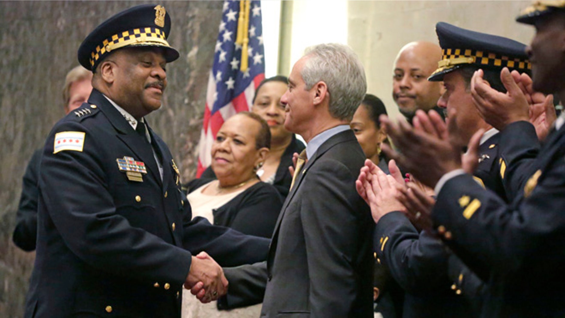 Chicago Mayor Rahm Emanuel shakes hands with Eddie Johnson on Wednesday, April 13, 2016, in Chicago.