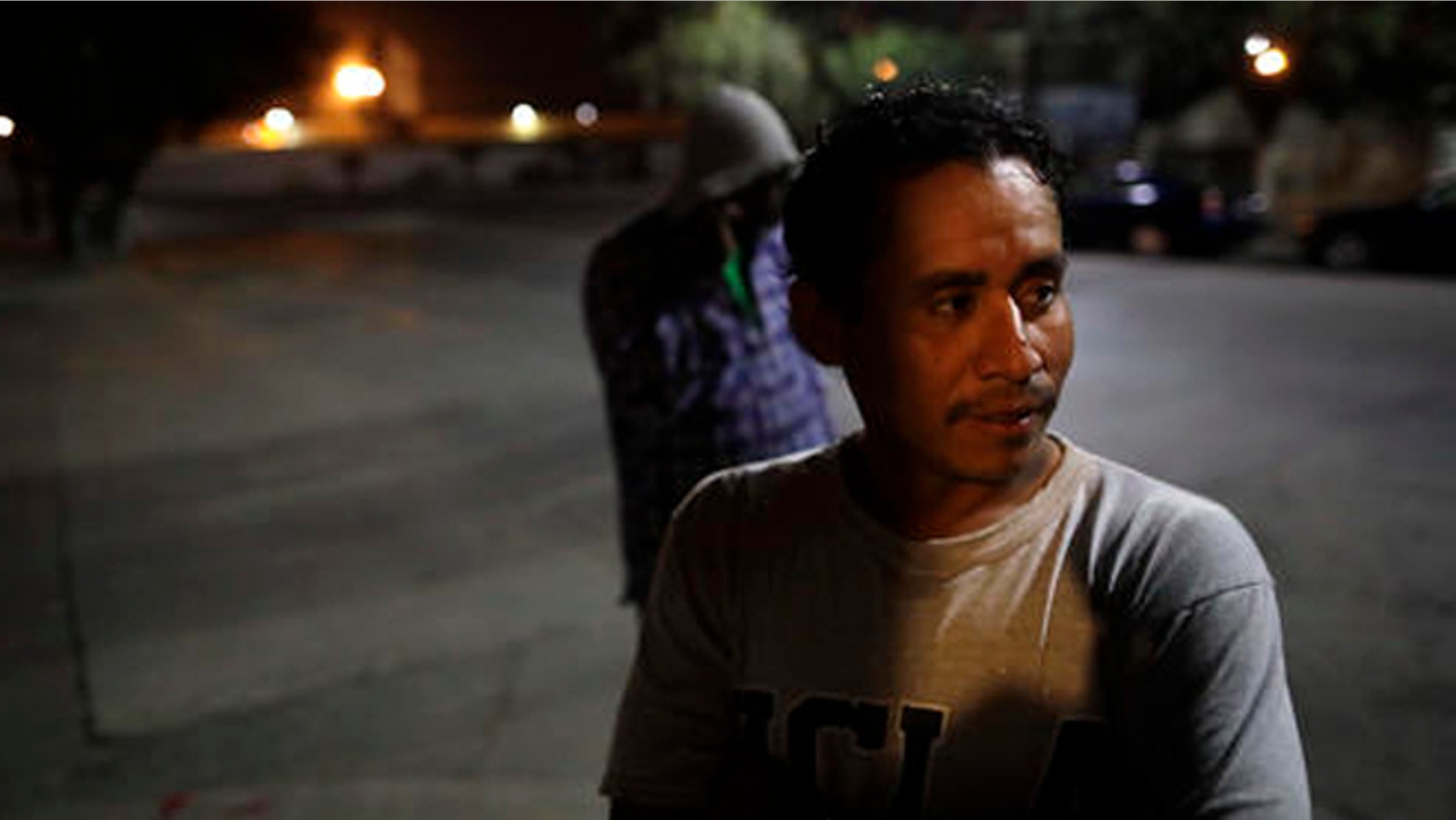 Guatamalan Elvin Vazquez looks on from a street in front of a shelter for migrants after being deported Monday, Nov. 14, 2016, in Tijuana, Mexico. Vazquez spent more than 13 years in the United States before being deported. In an interview with CBS' "60 Minutes" broadcast Sunday night, President-elect Donald Trump said he would focus on deporting people with criminal records beyond their immigration status. (AP Photo/Gregory Bull)