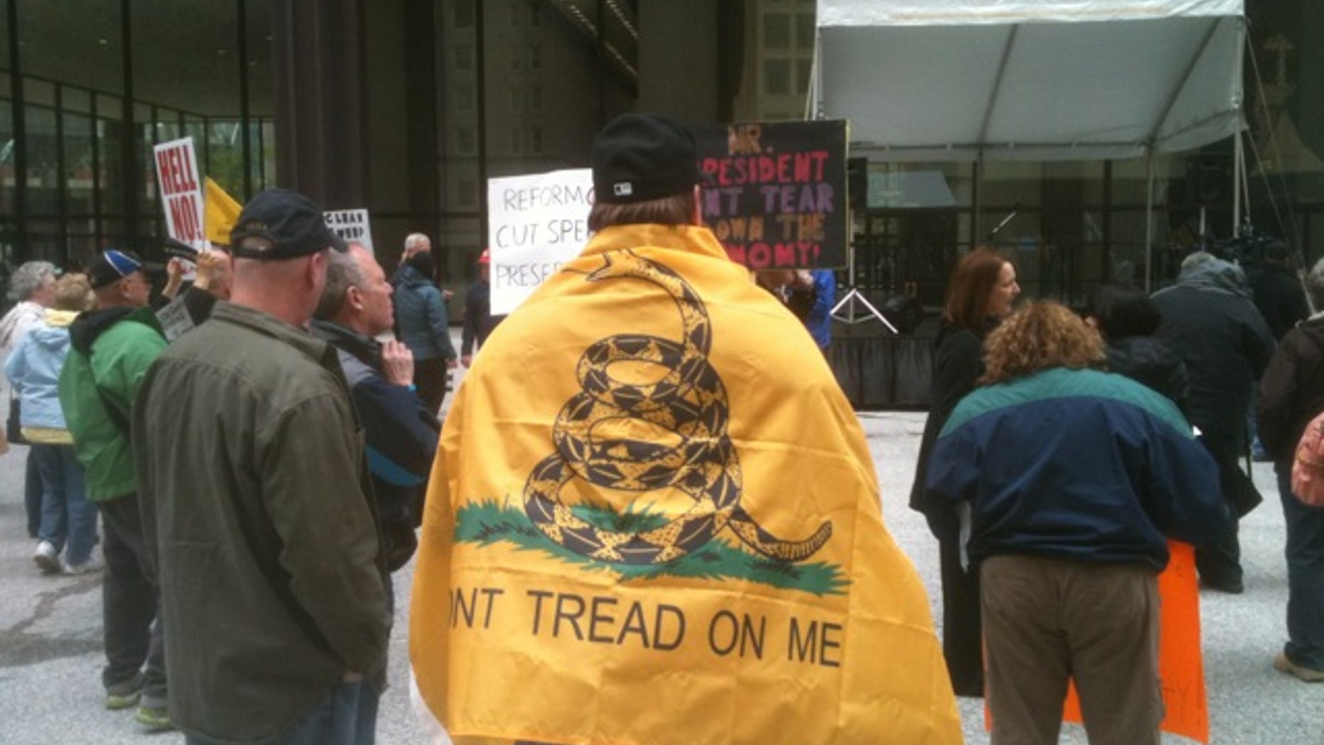 A tea party activist wears a replica of the 1775 Gadsden flag at the 2012 Tea Party Tax Day Rally in Chicago, Ill. (Michael Volpe / The Daily Caller)