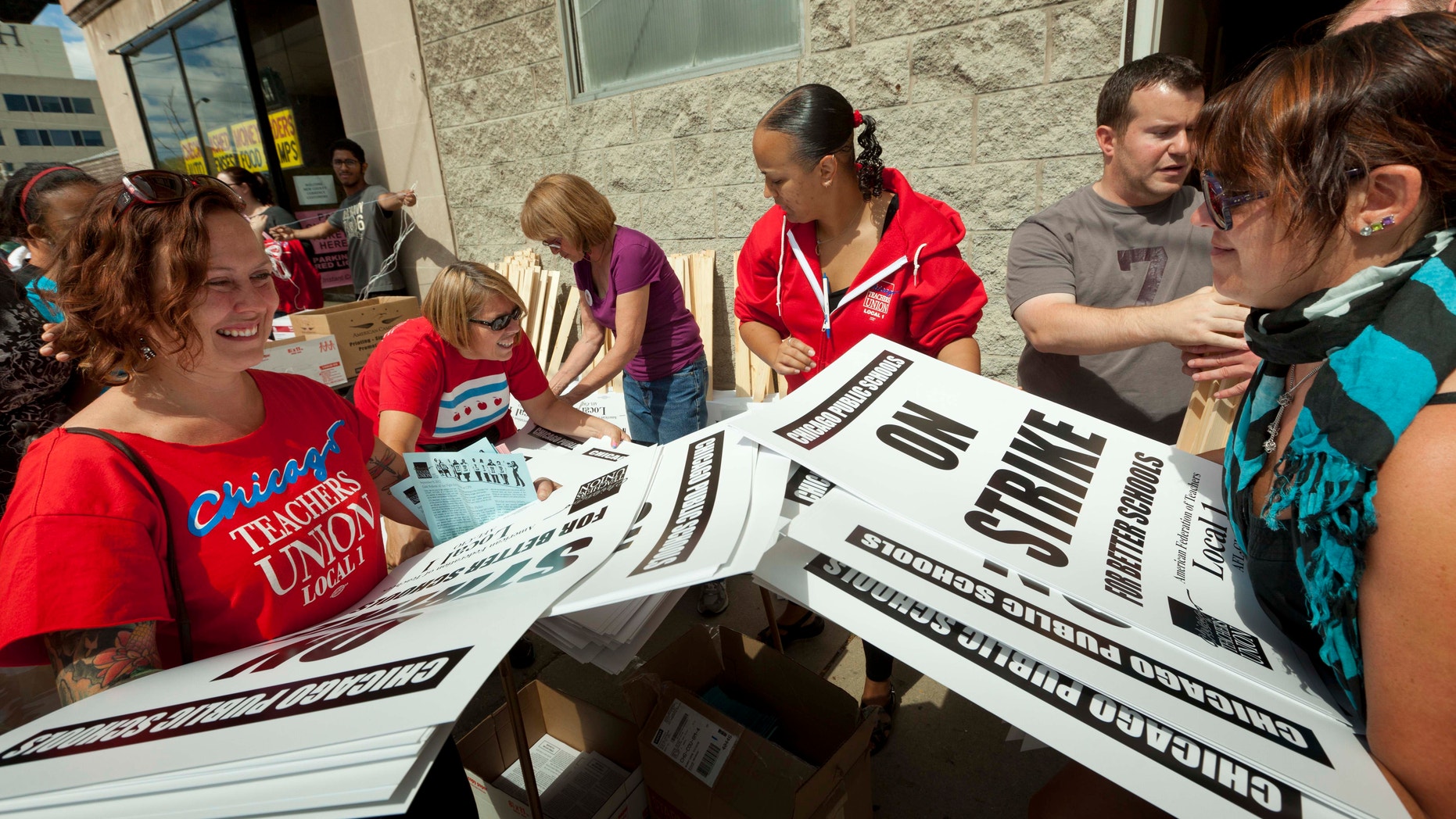 Sept. 8, 2012: Members of the Chicago Teachers Union distribute strike signage at the Chicago Teachers Union strike headquarters.